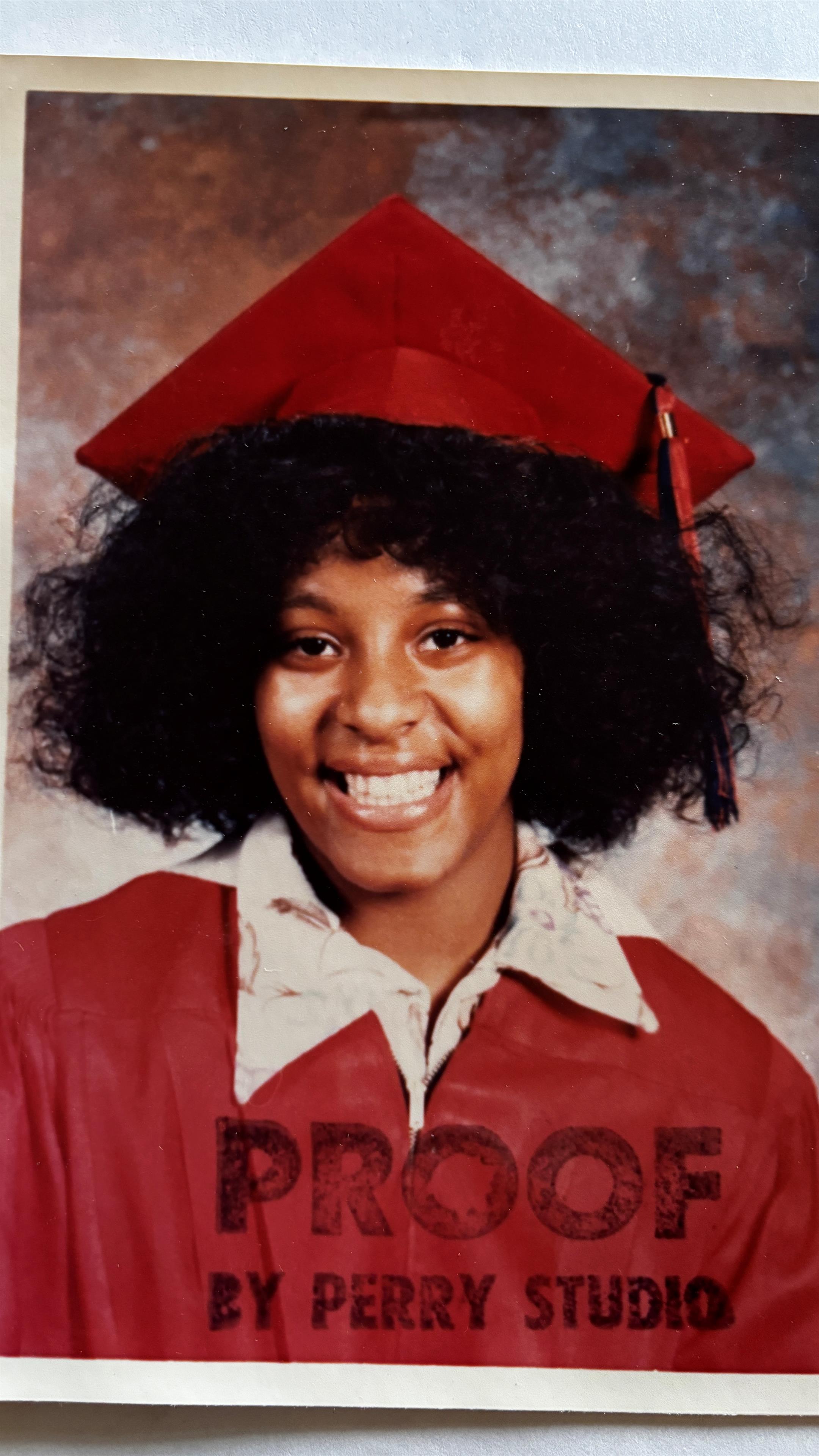 A woman in a graduation cap and gown