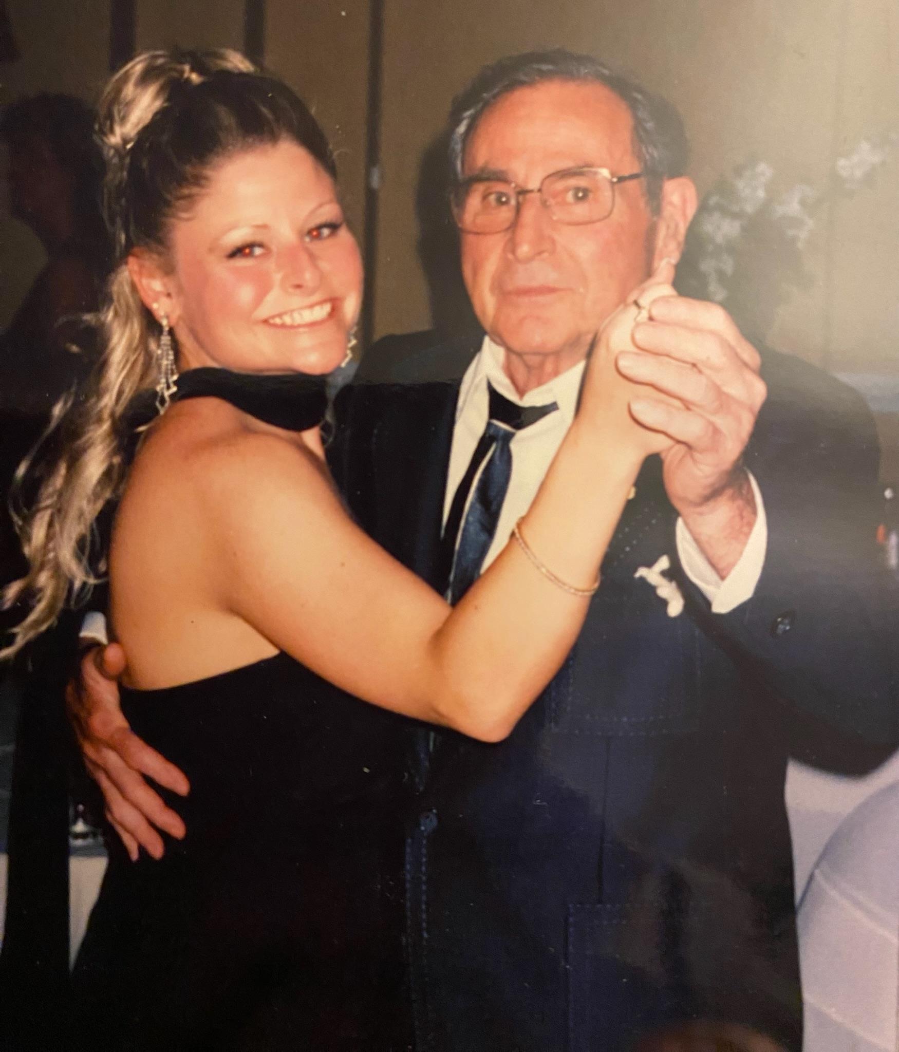 A man and woman posing for a picture