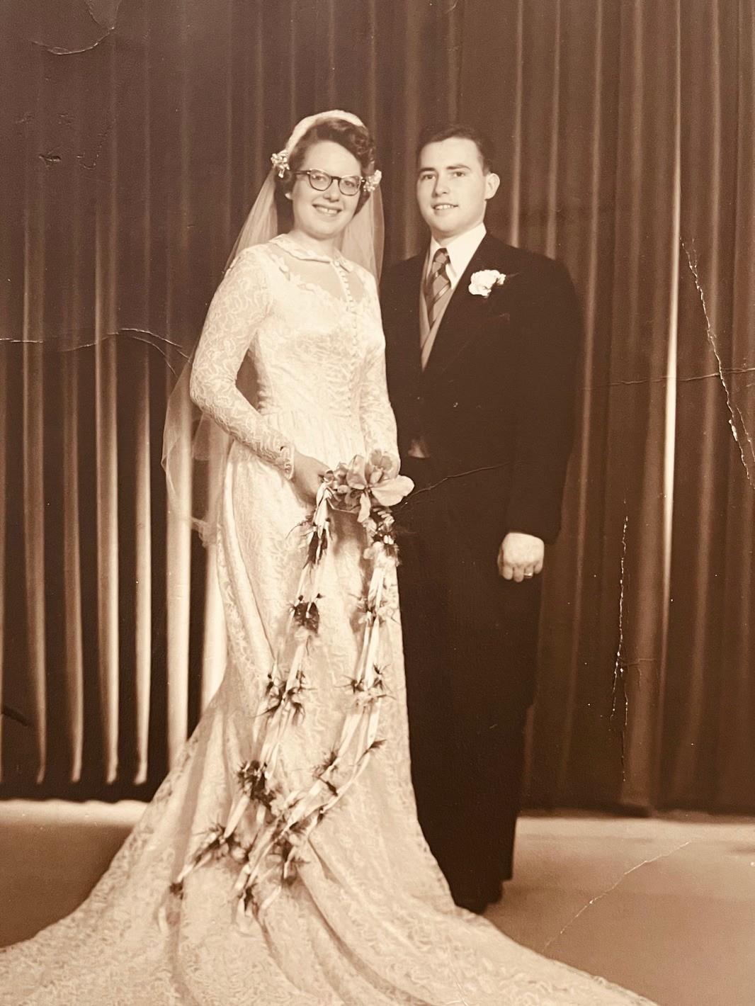 A man and woman in wedding attire