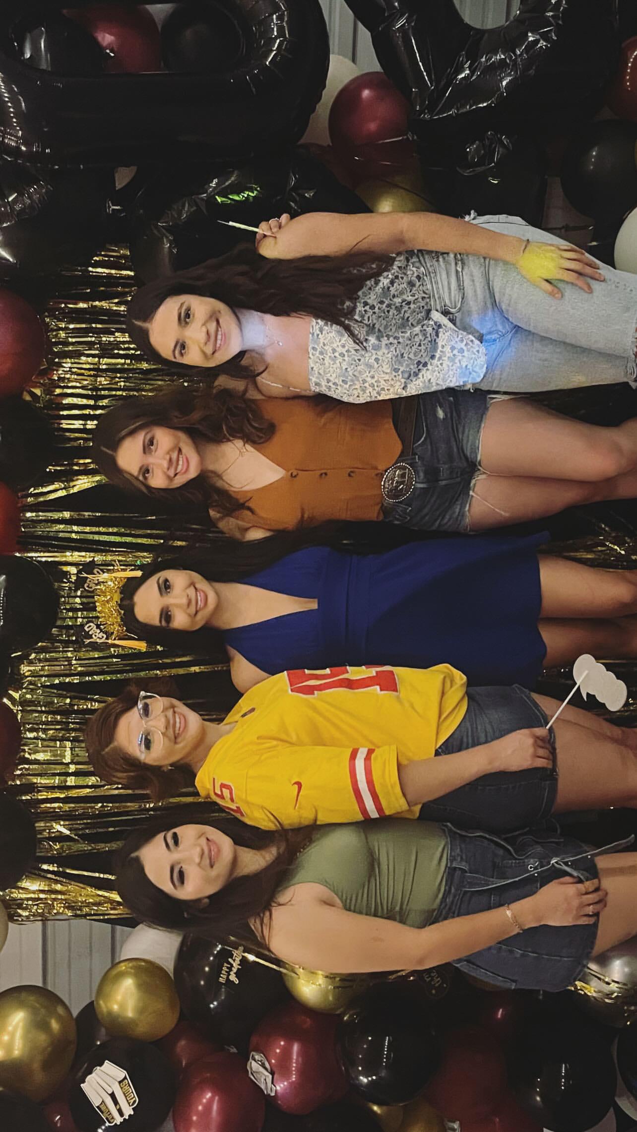 A group of women posing for a photo