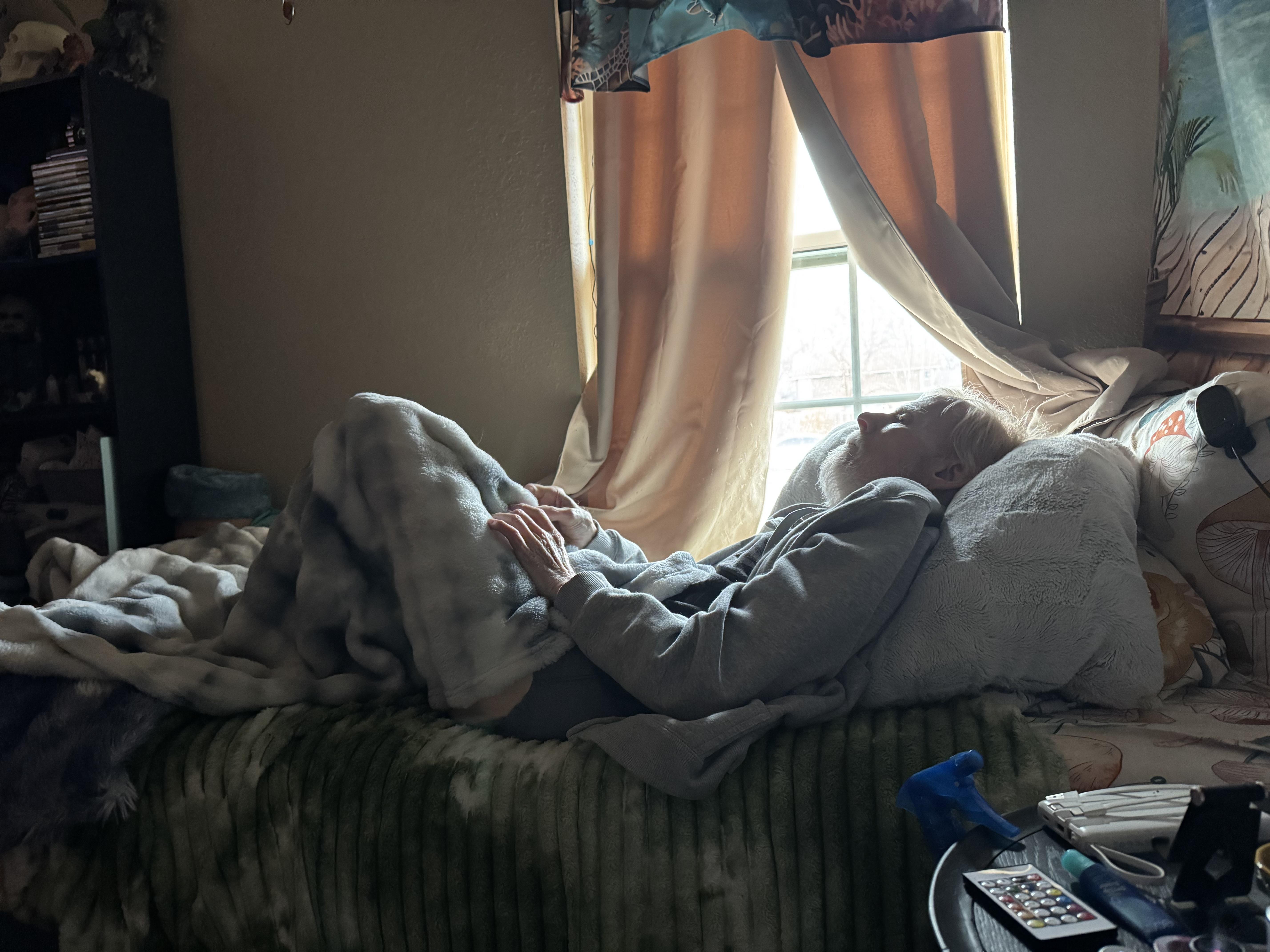 A person lying on a bed