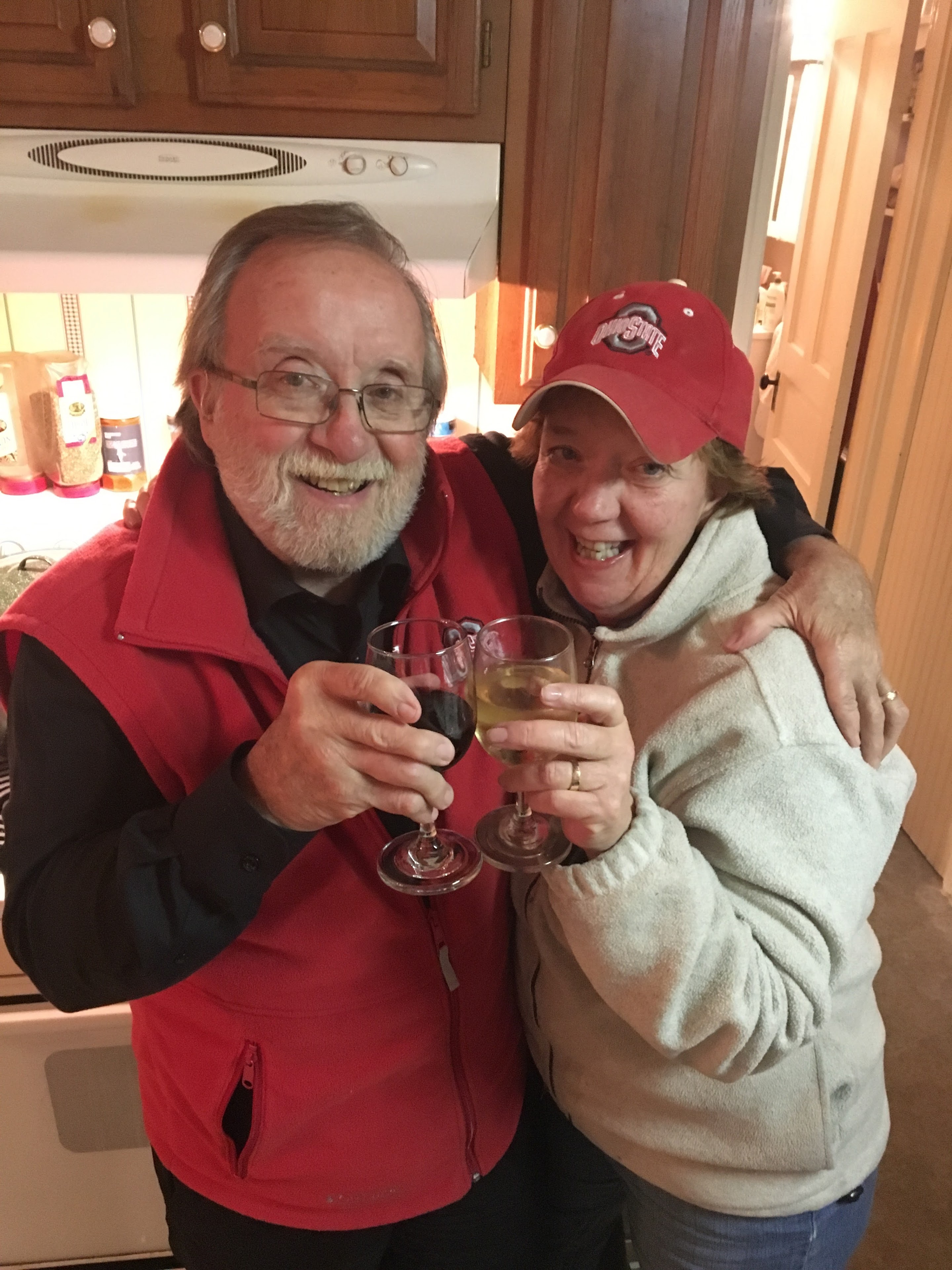A man and woman holding wine glasses