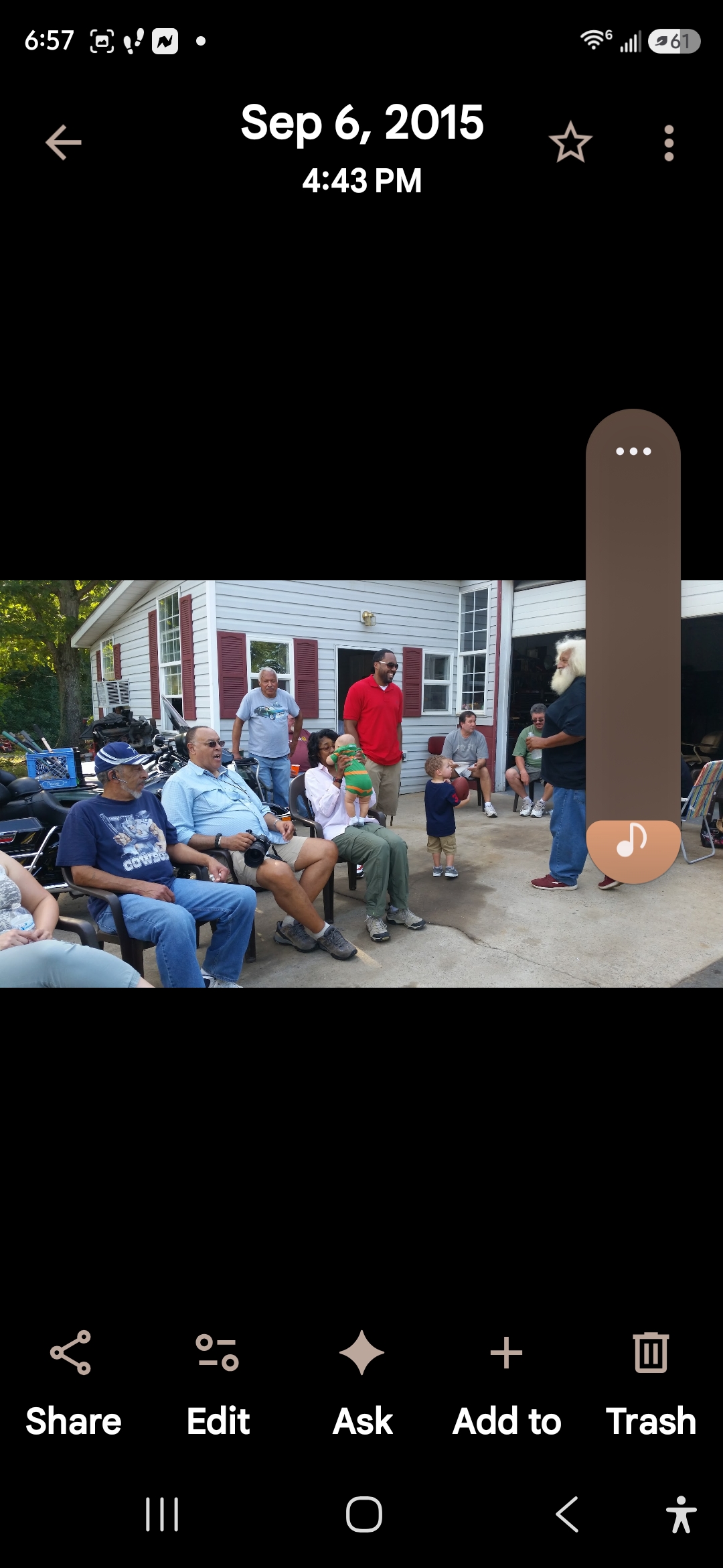 A group of people sitting outside