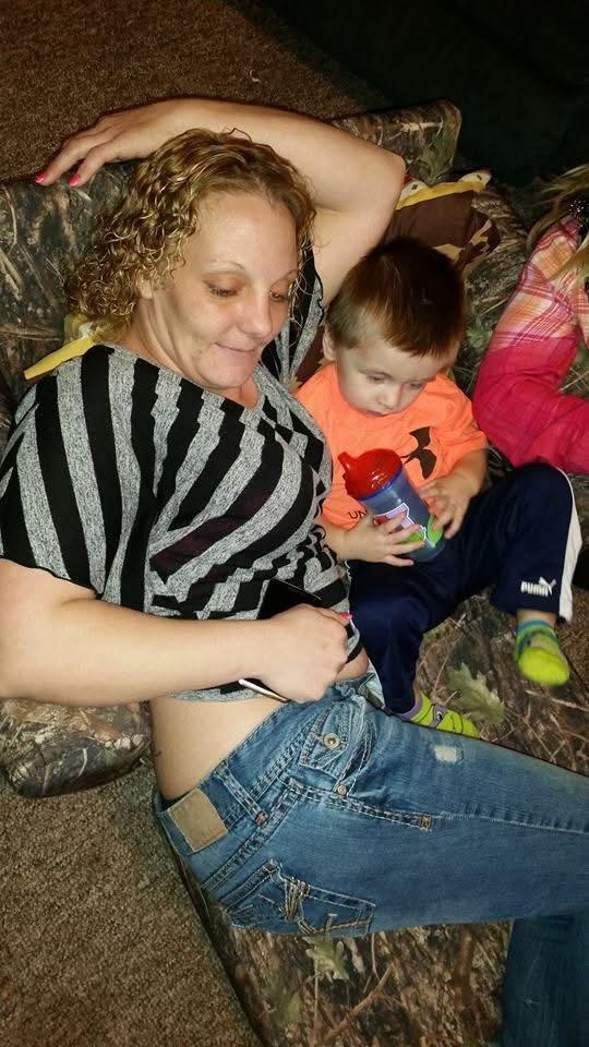 A woman and a child sitting on the floor