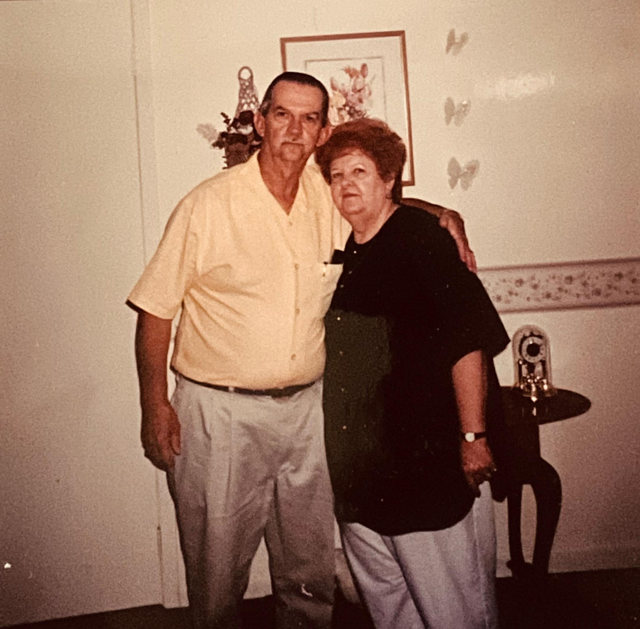 A man and woman posing for a picture