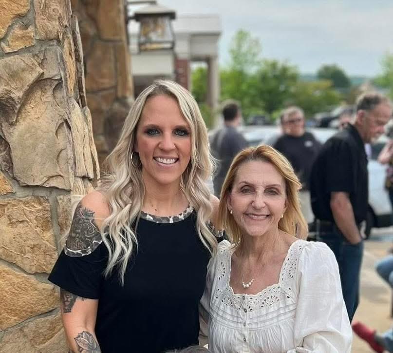 Two women standing next to each other