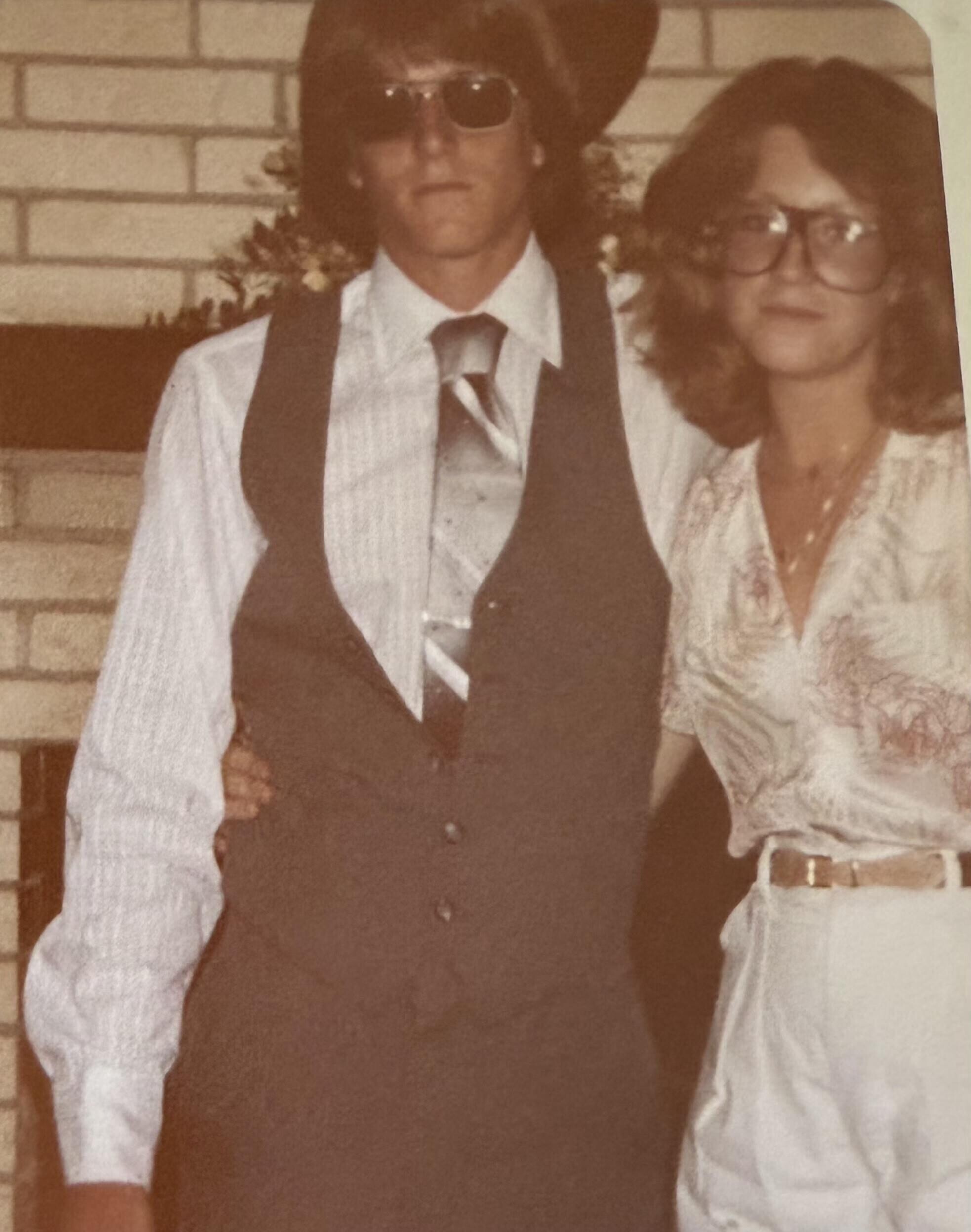 A man and woman posing for a picture