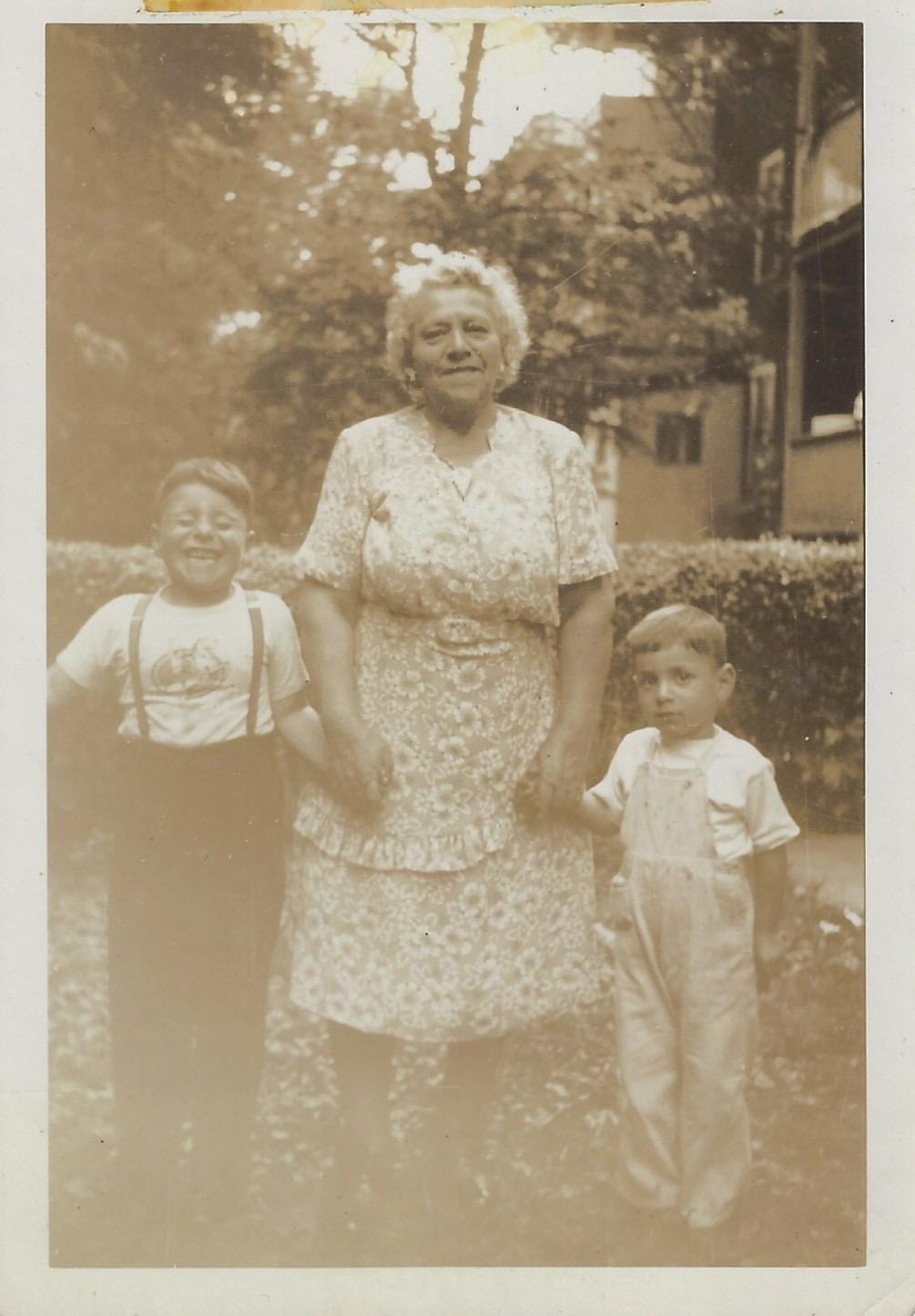 A woman and two boys posing for a picture