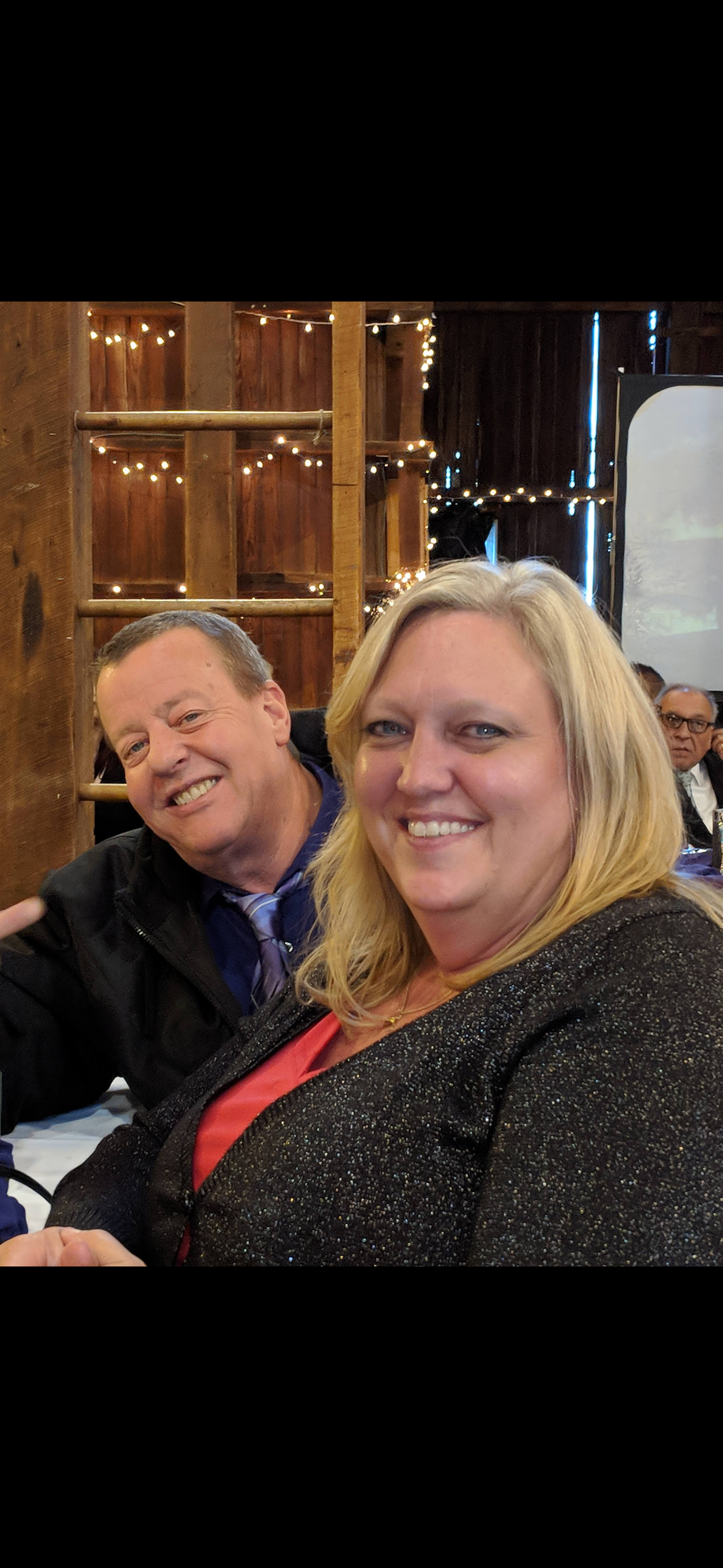 A man and woman smiling for a picture