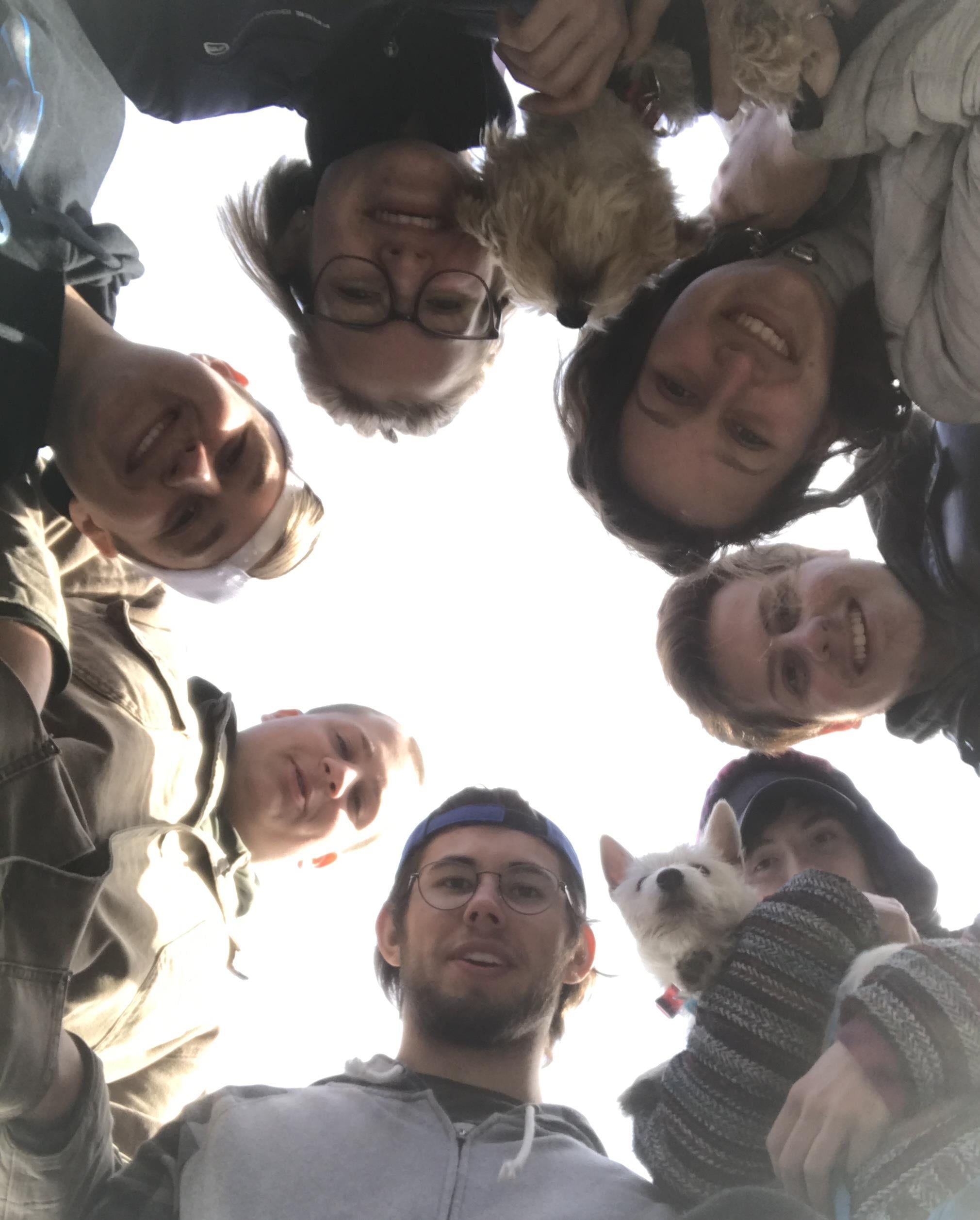 A group of people looking down at the camera