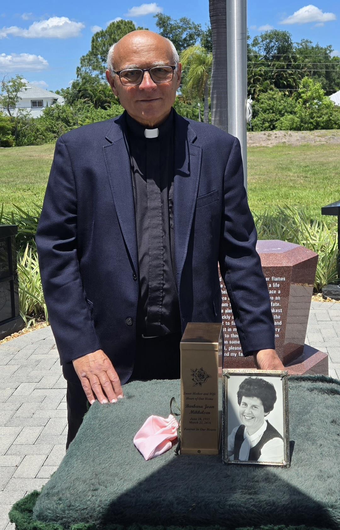 A man standing in front of a memorial