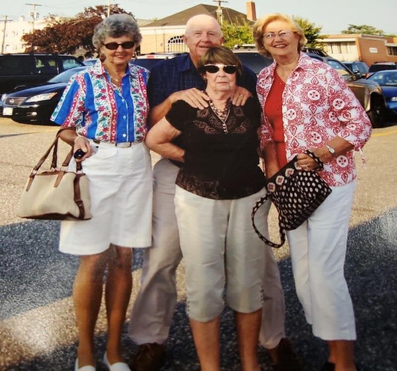 A group of older people posing for a photo