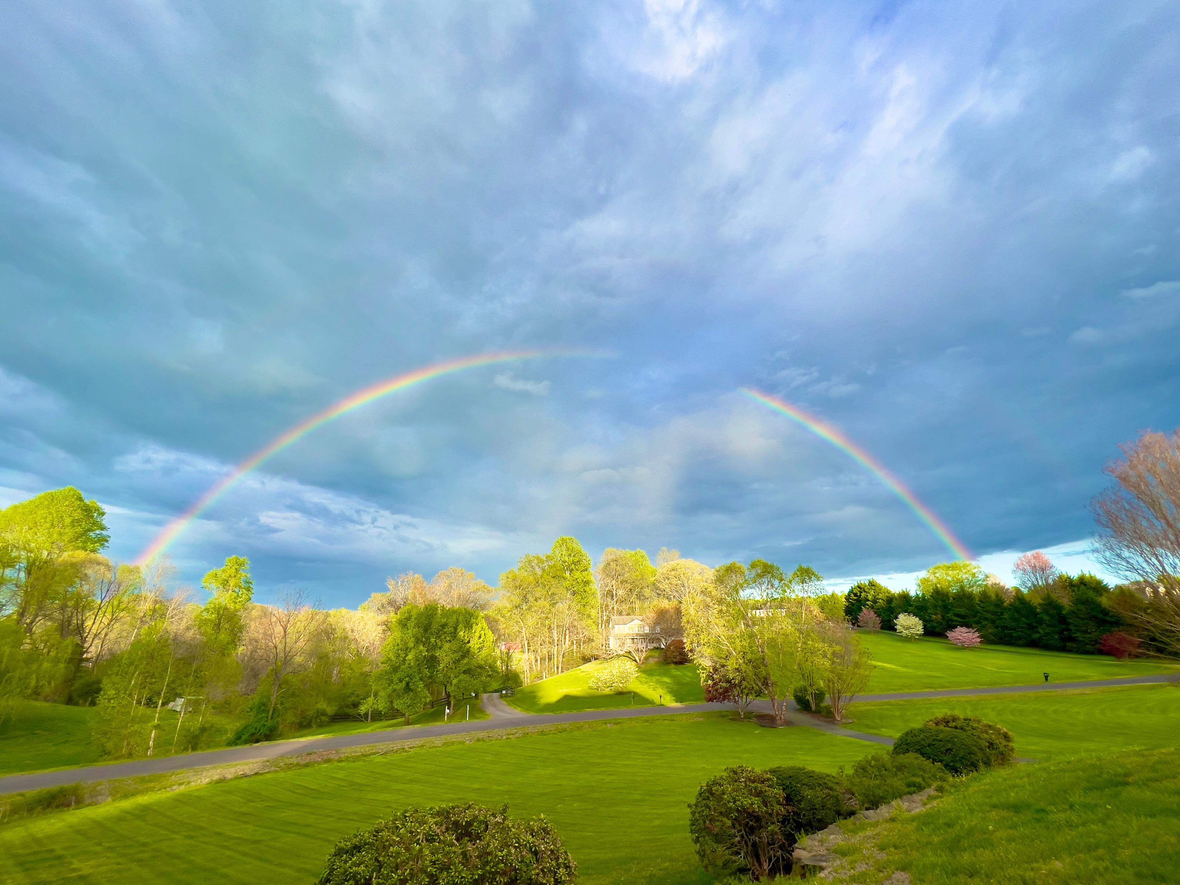 A rainbow over a green field