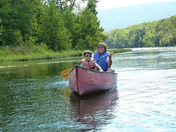 A woman and child in a canoe