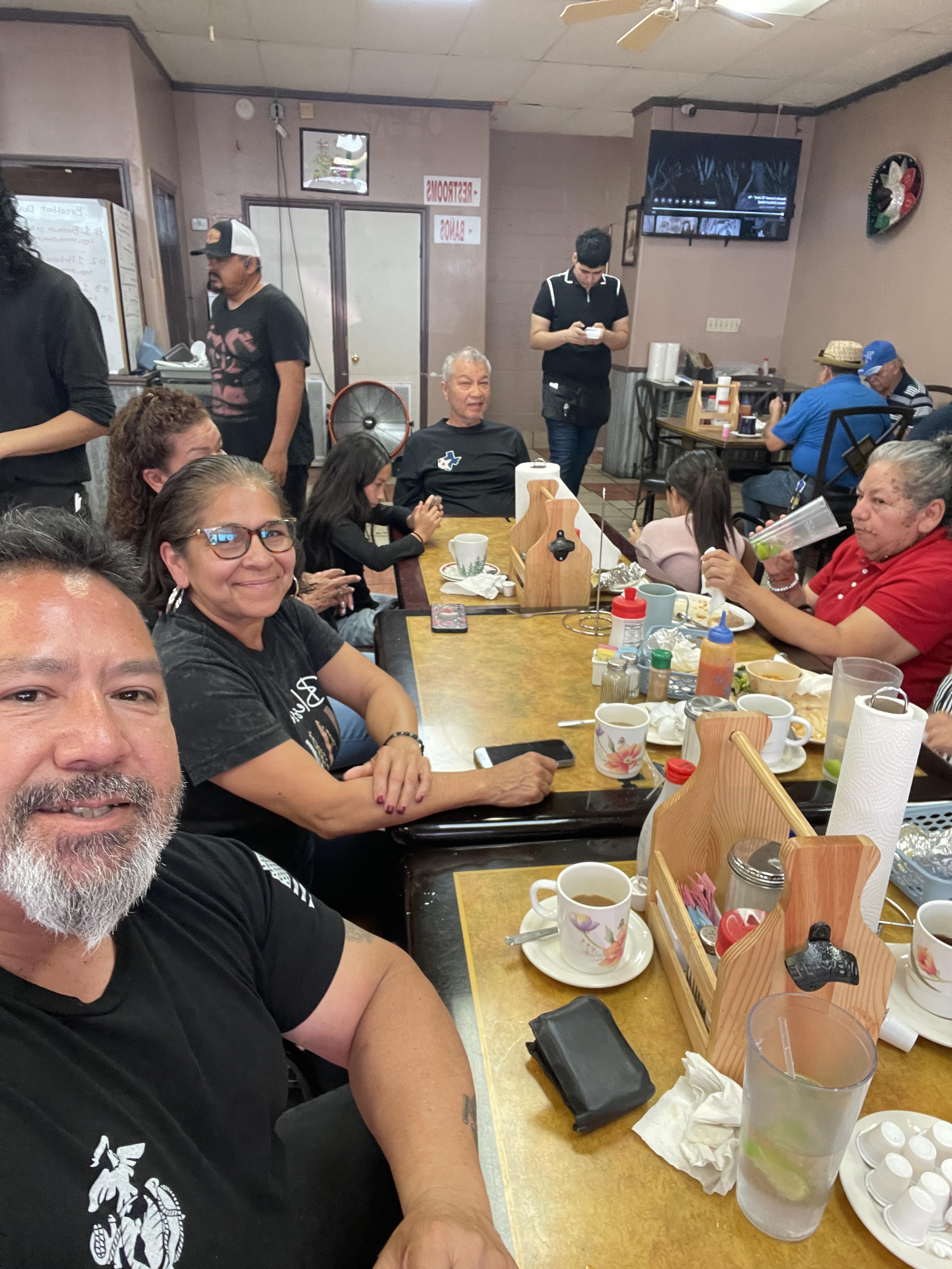 A group of people sitting at a table