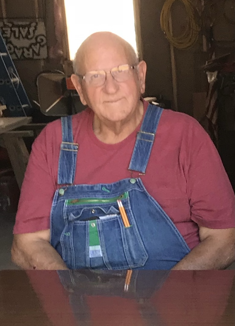 A man wearing glasses and a red shirt