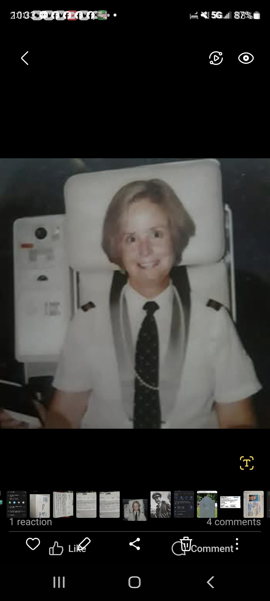 A woman in uniform sitting in a chair