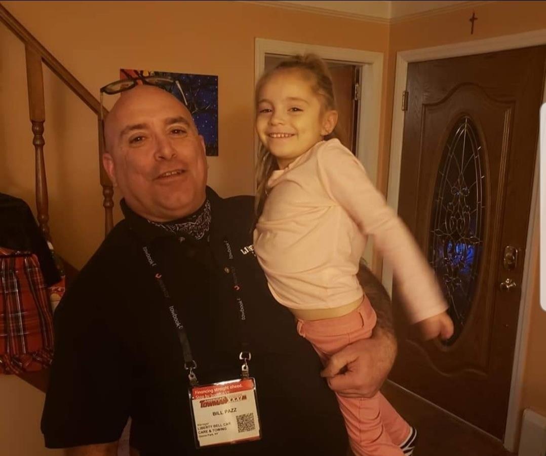 A man holding a girl