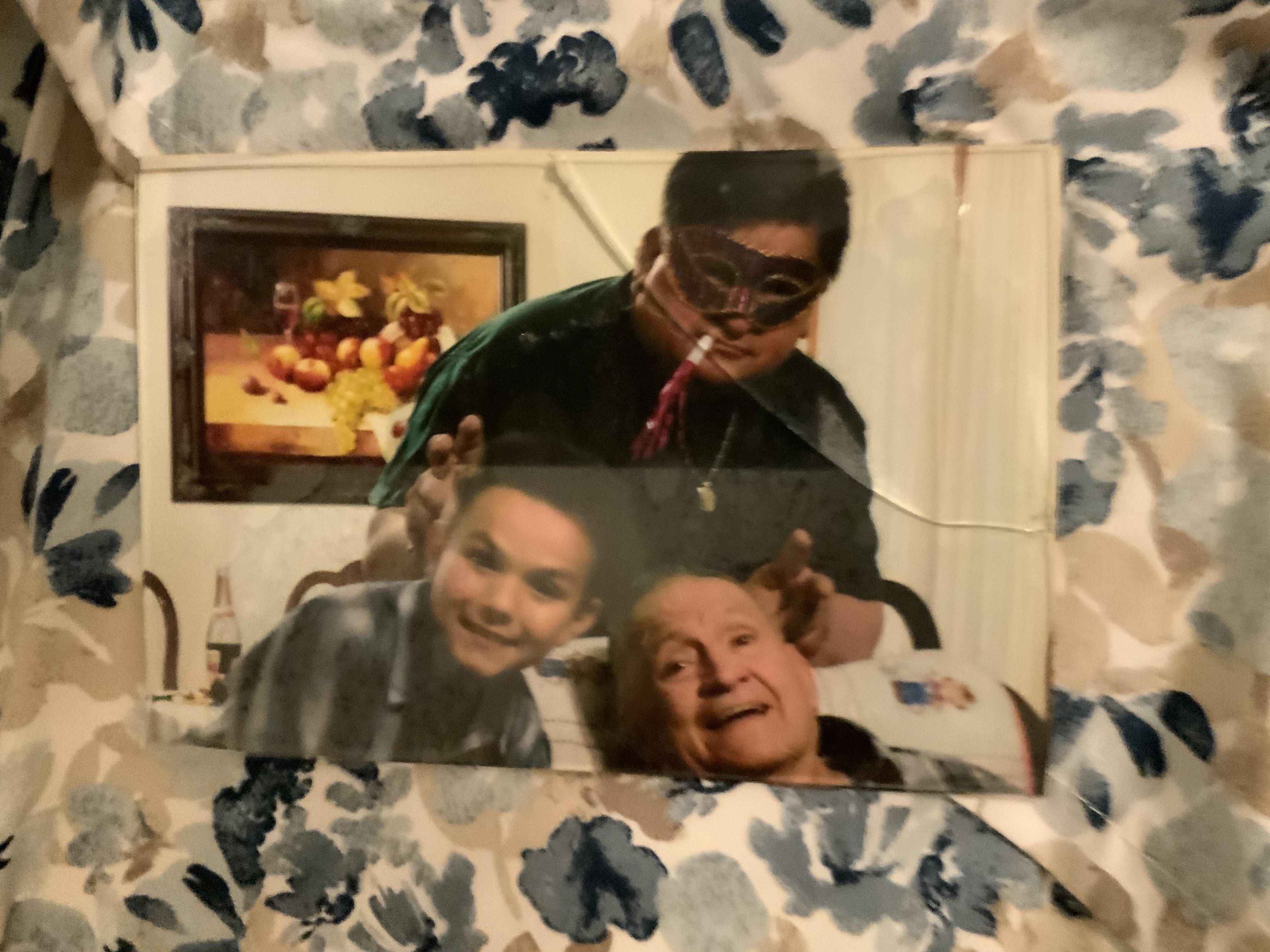 A picture of a man and two children