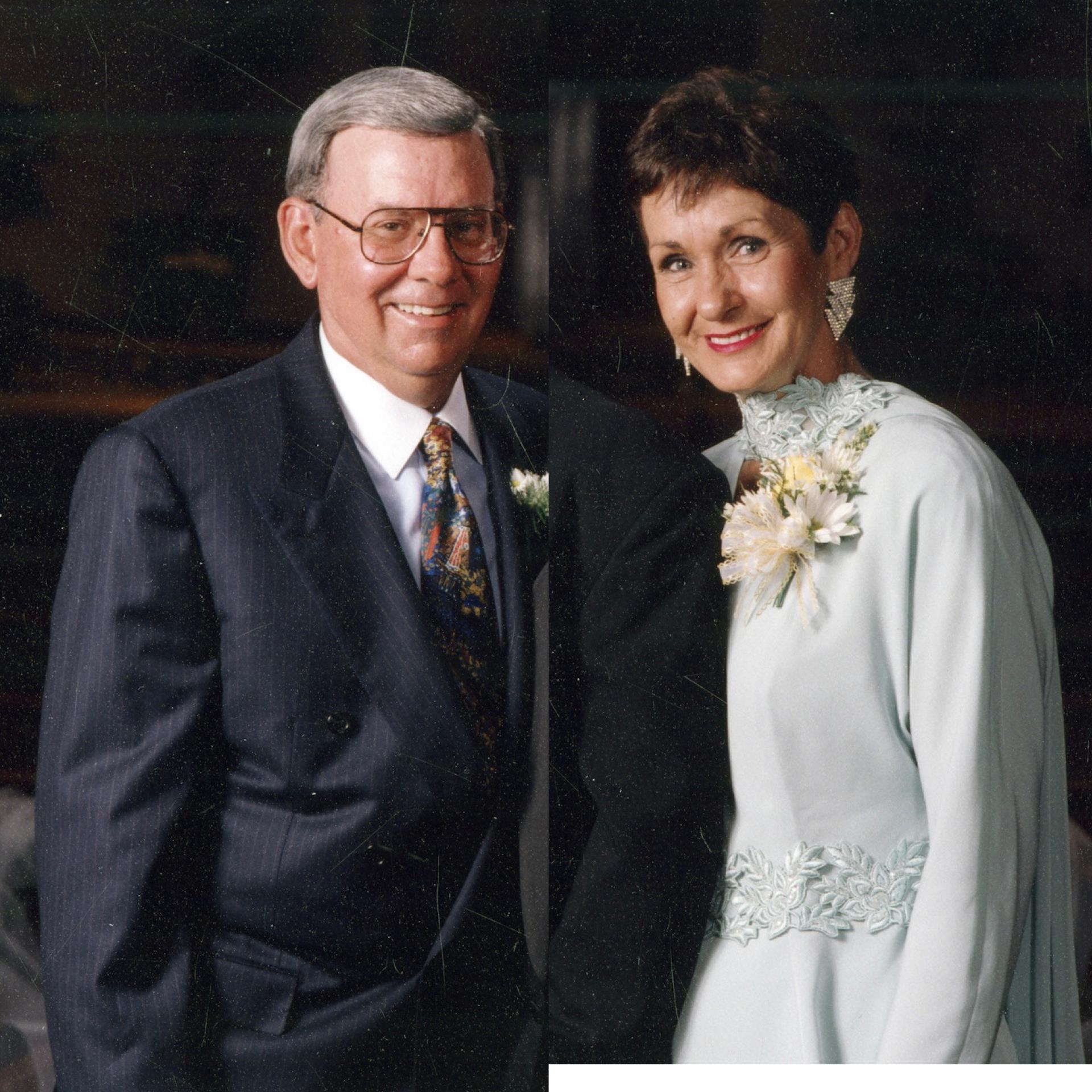 A man and woman posing for a picture