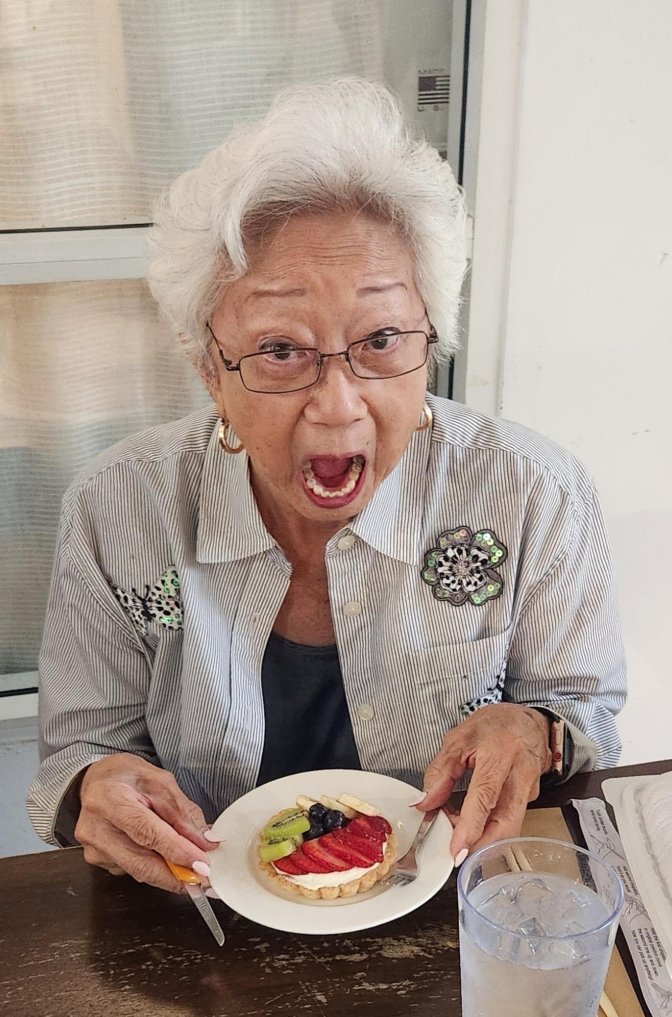 An old woman with her mouth open