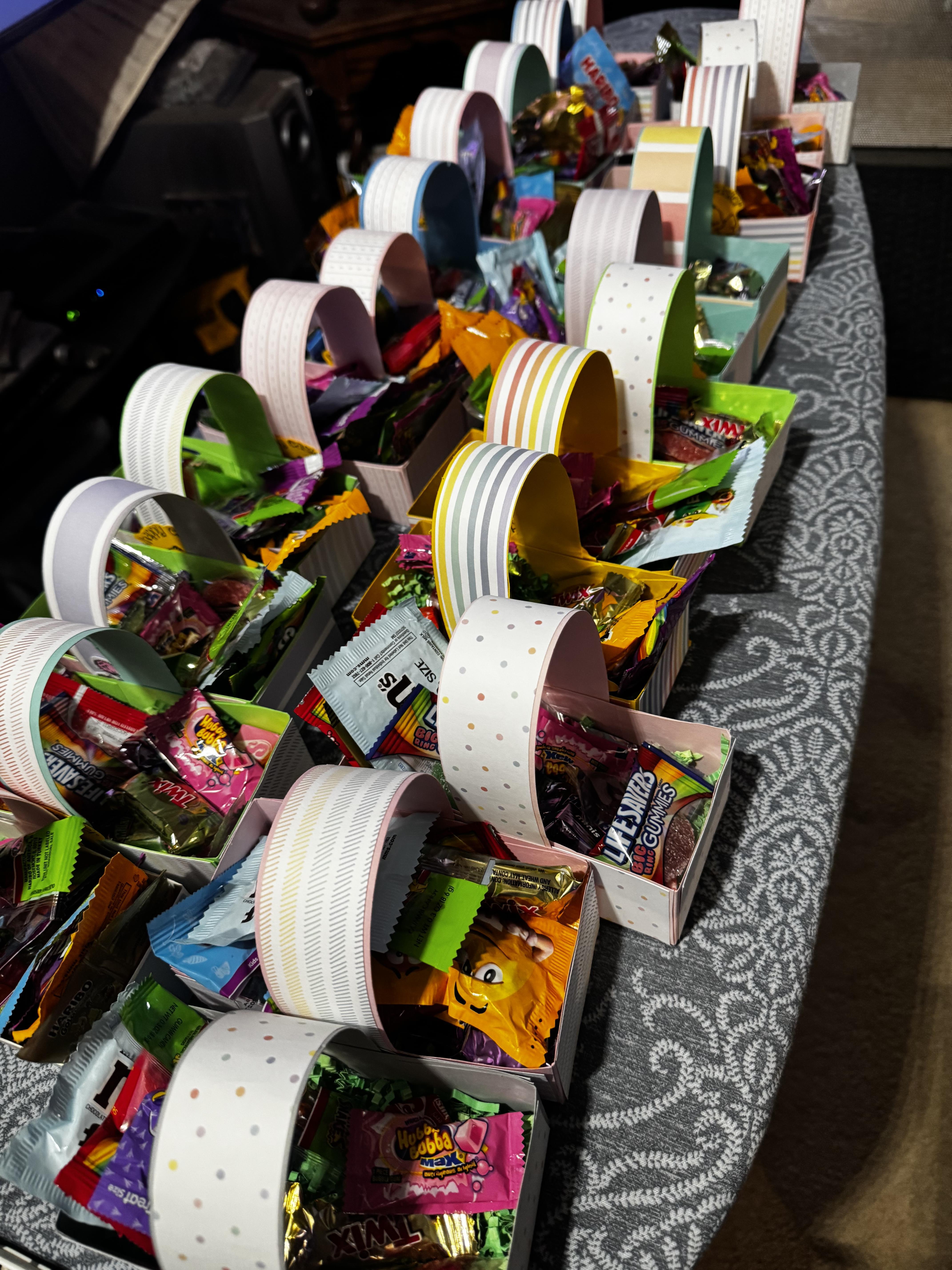 A group of small containers of candy