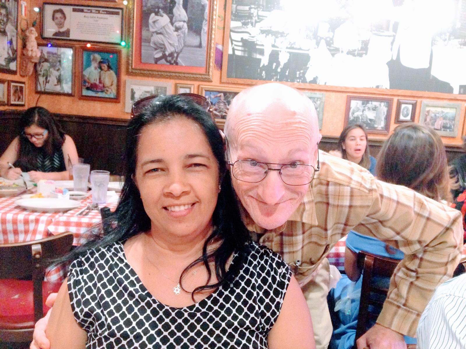 A man and woman posing for a picture