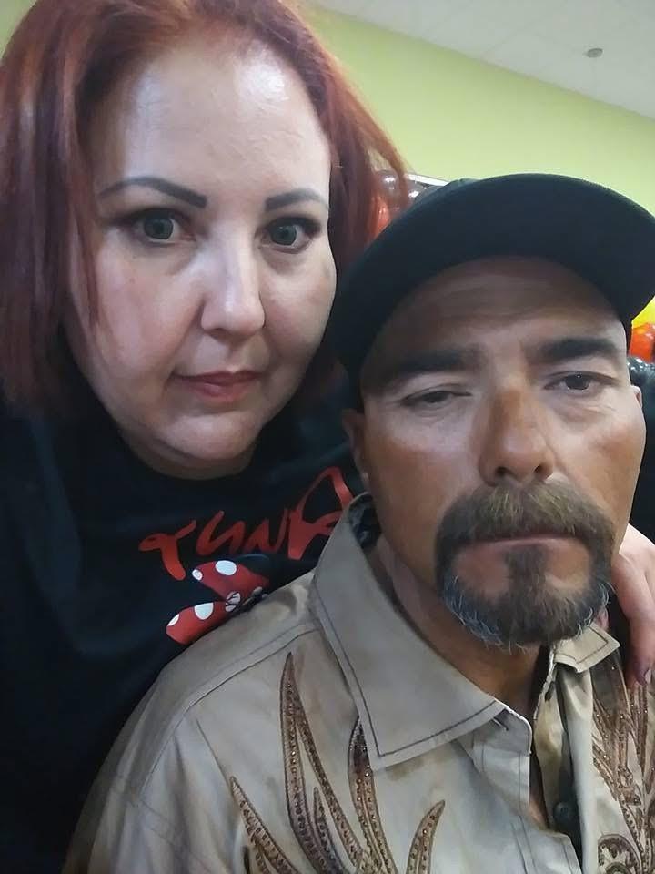 A woman and a man taking a selfie