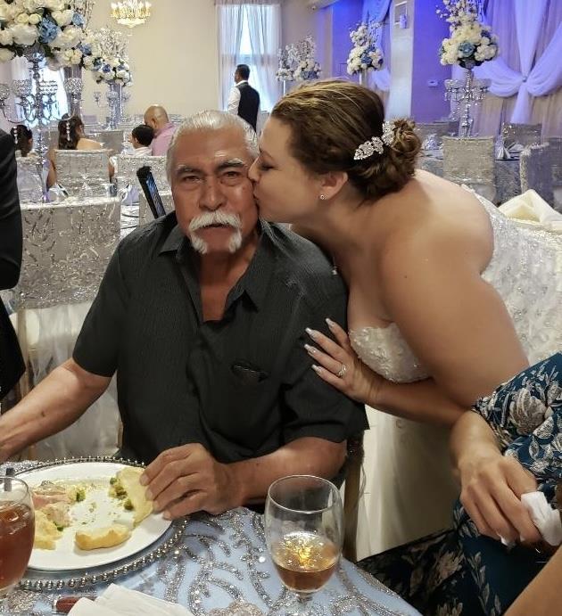 A woman kissing a man