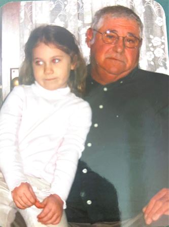A man and a girl posing for a picture