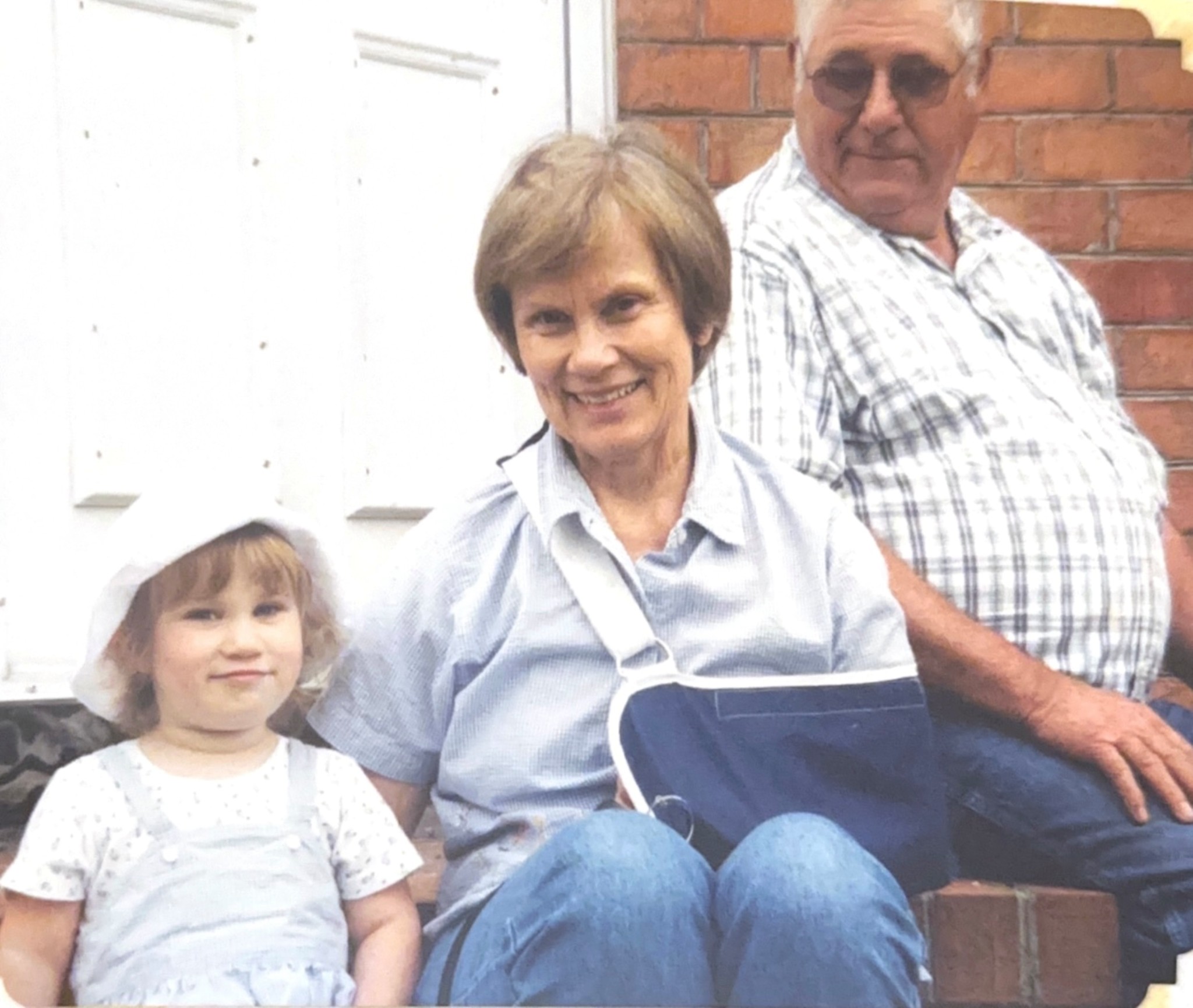 A woman and a child sitting on a staircase