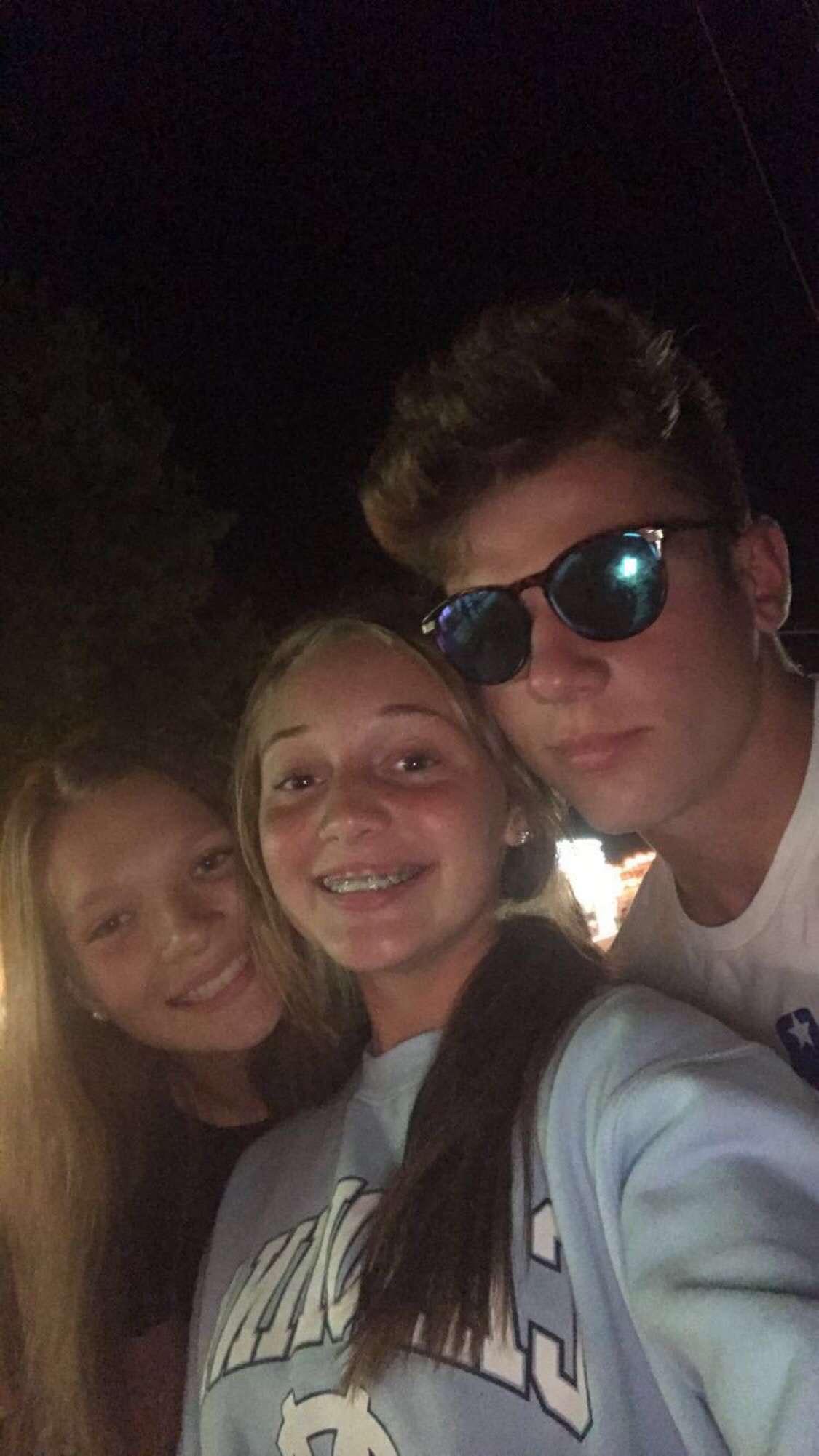 A group of people taking a selfie