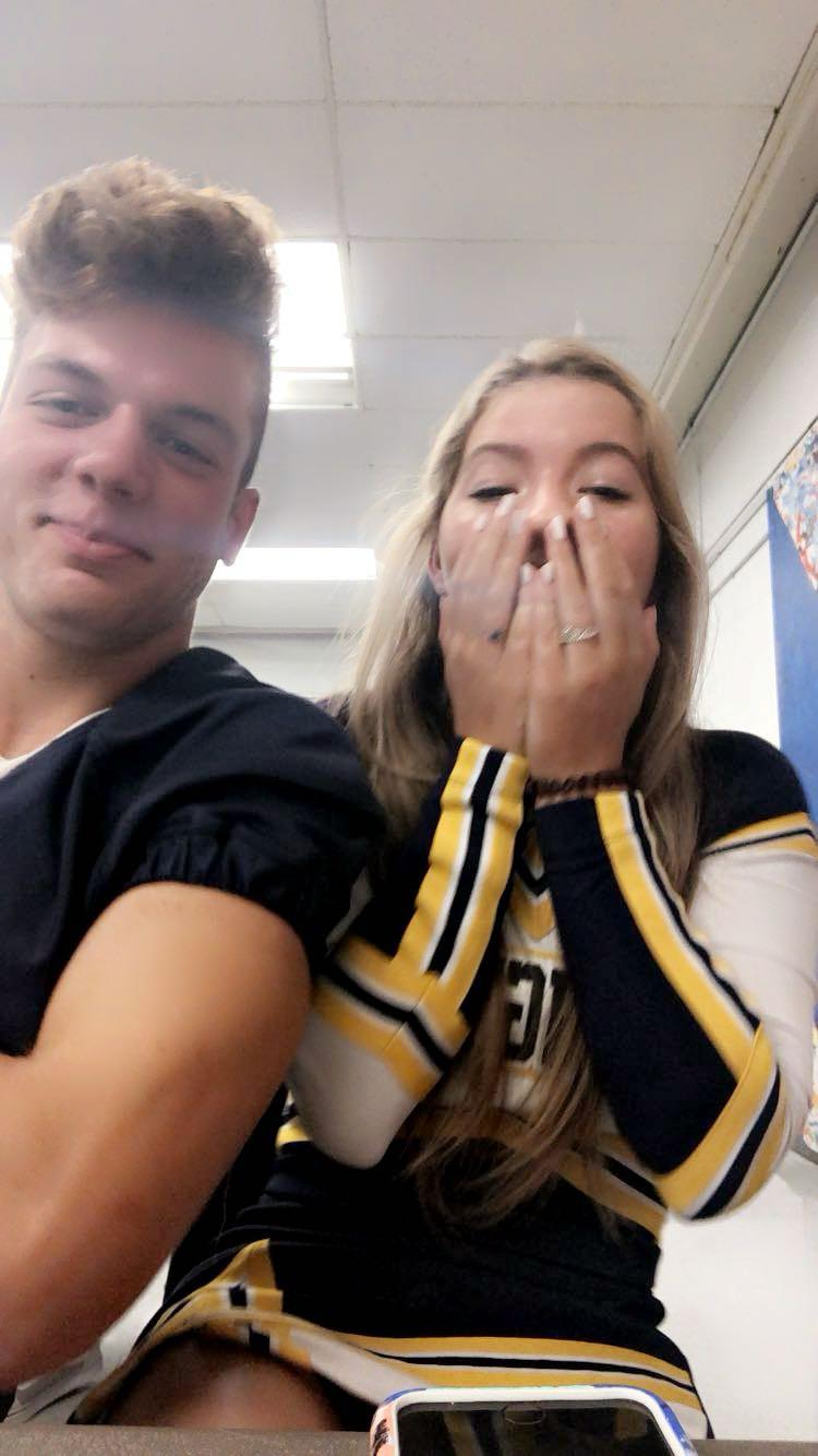 A man and woman posing for a picture