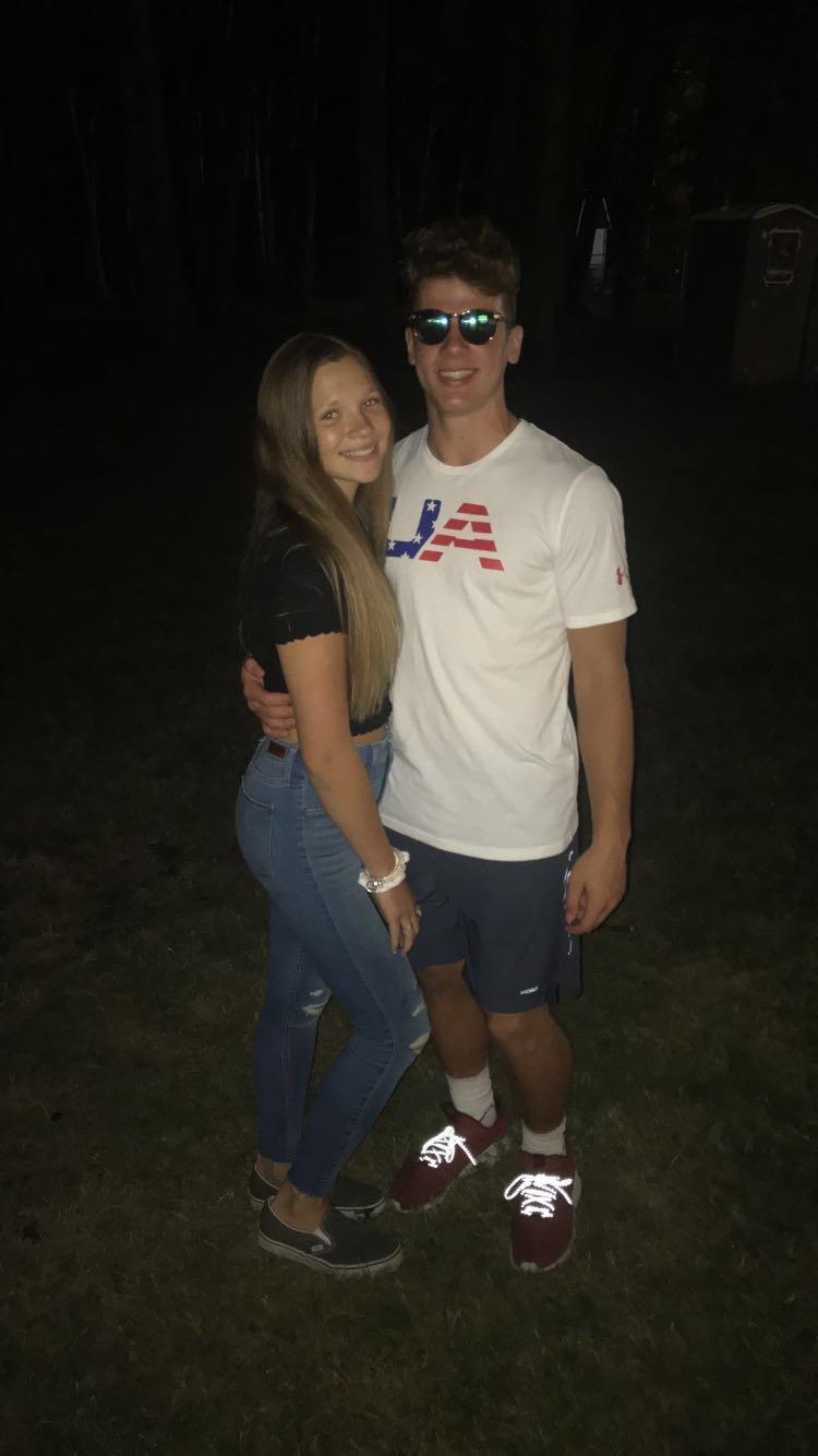 A man and woman posing for a picture