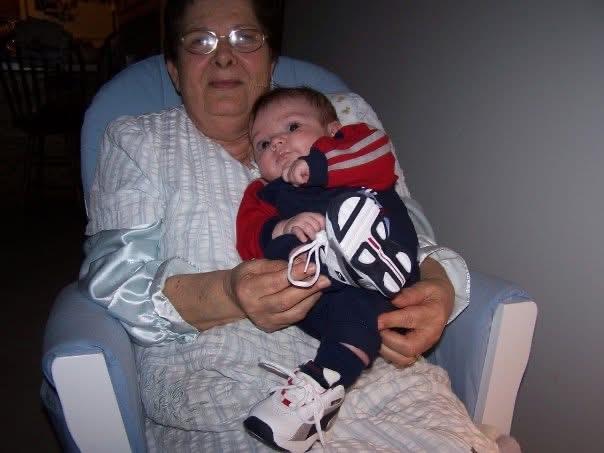 A woman holding a baby