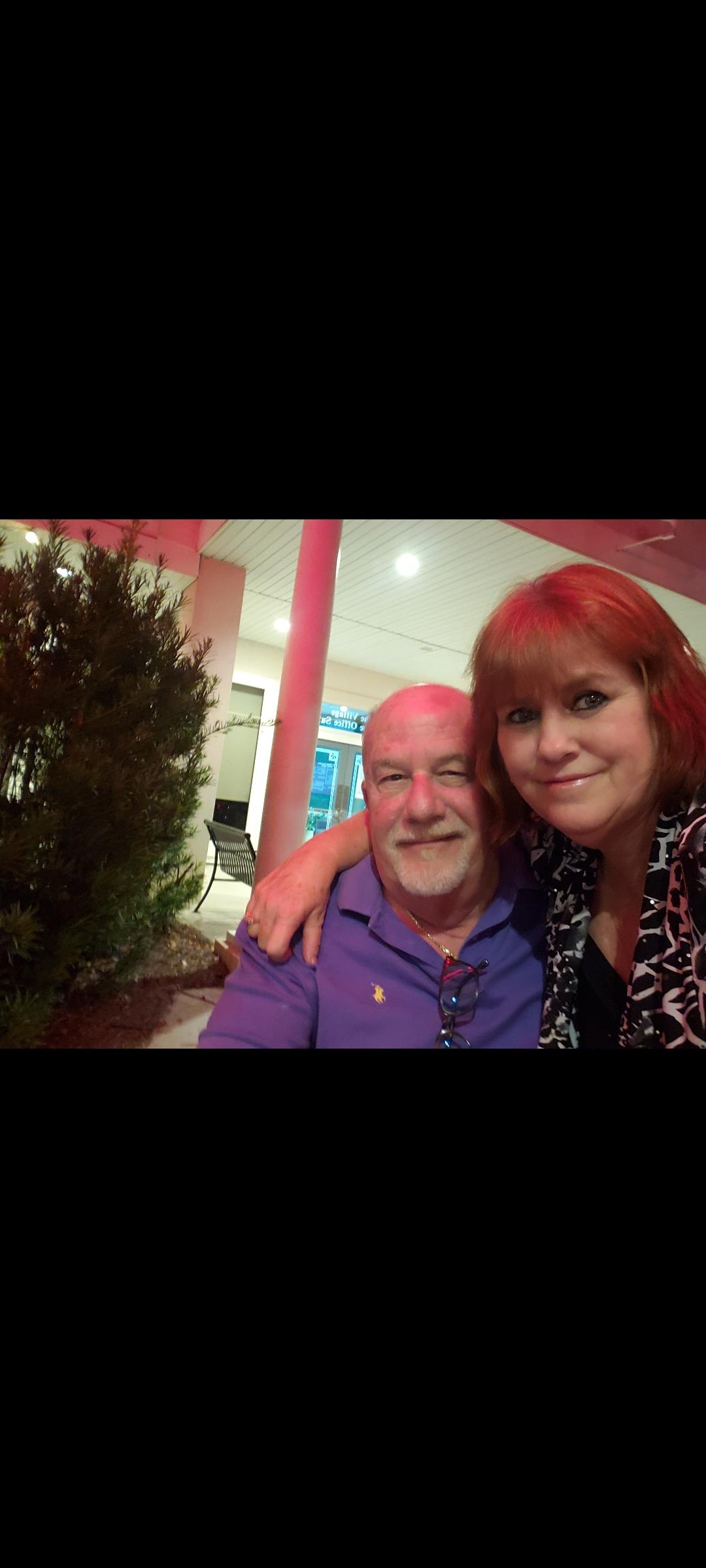 A man and woman taking a selfie