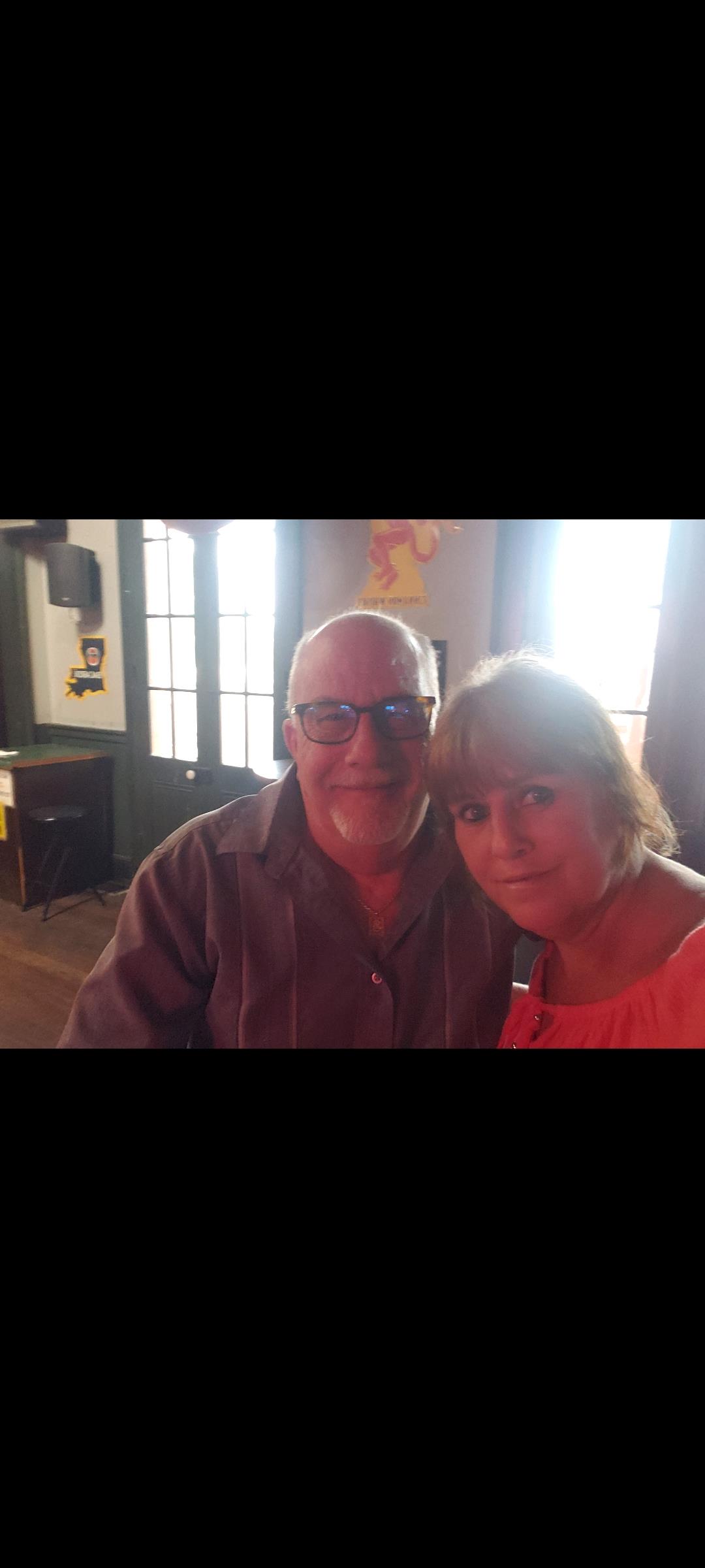 A man and woman posing for a picture