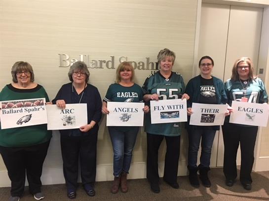 A group of women holding signs