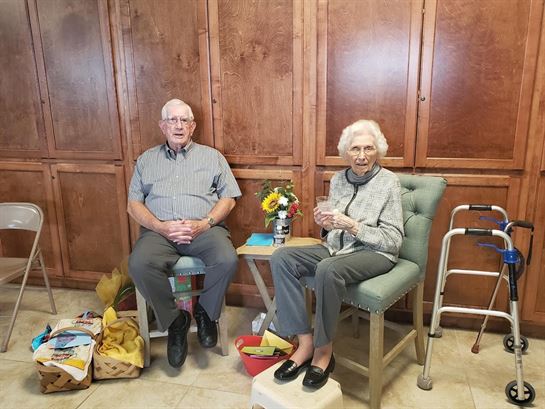 A man and woman sitting in chairs