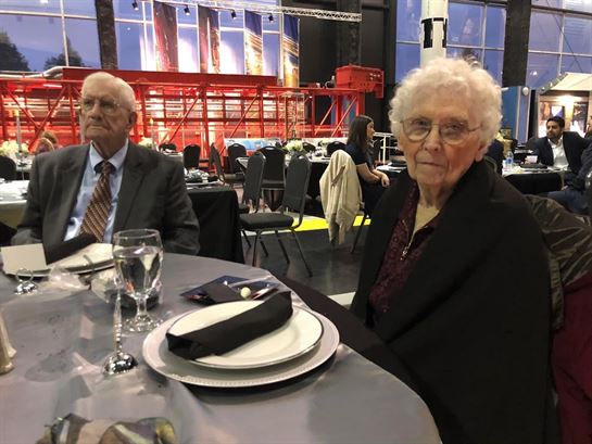 A man and woman sitting at a table