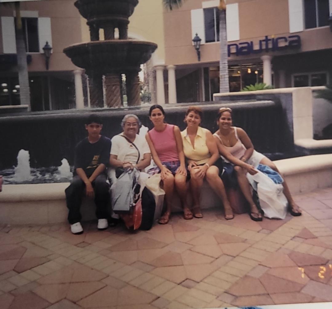 A group of people sitting on a fountain