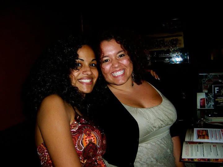 A couple of women smiling at the camera