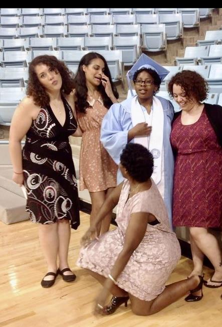 A group of women in a graduation gown
