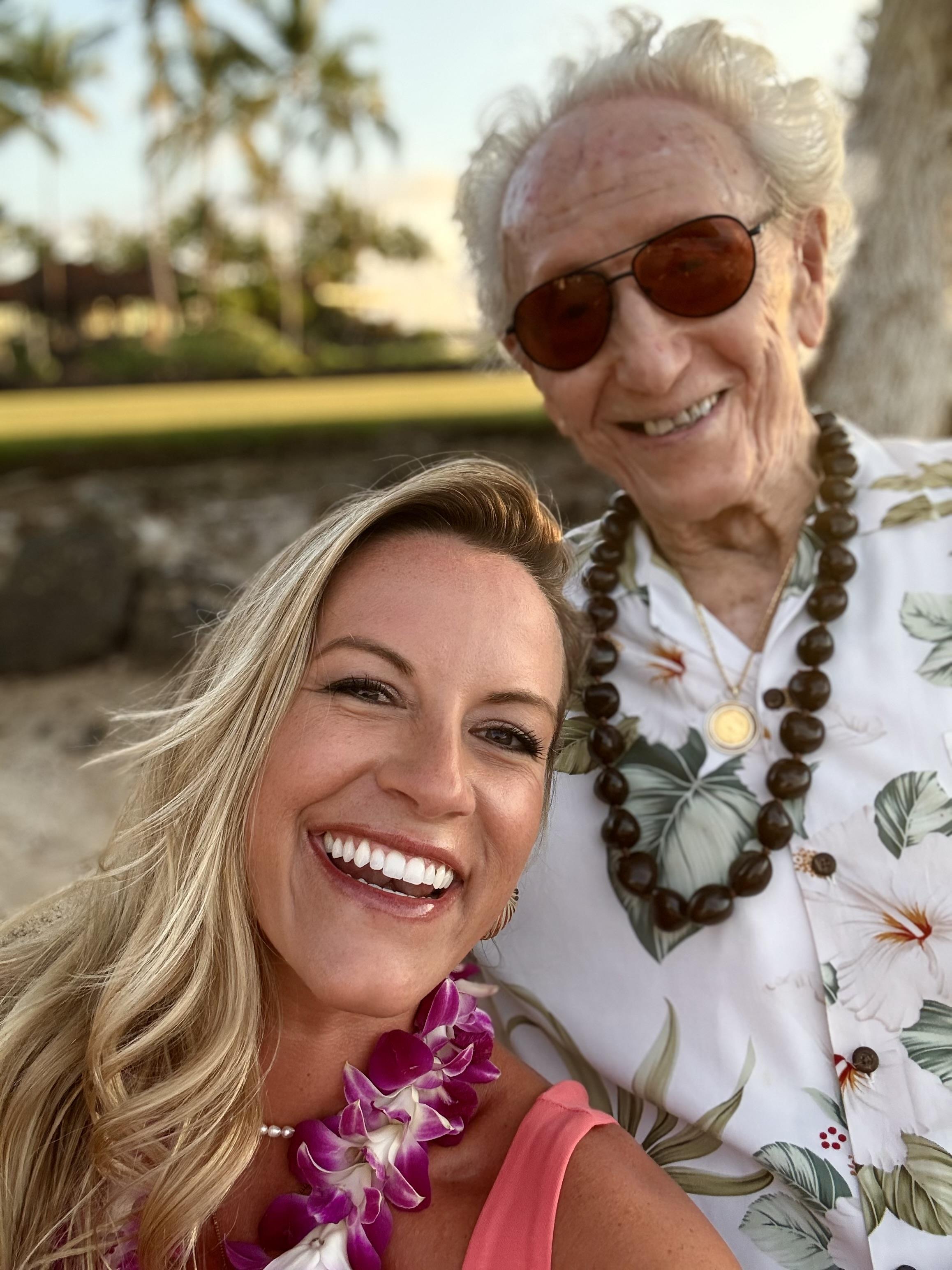 A woman and an old man smiling