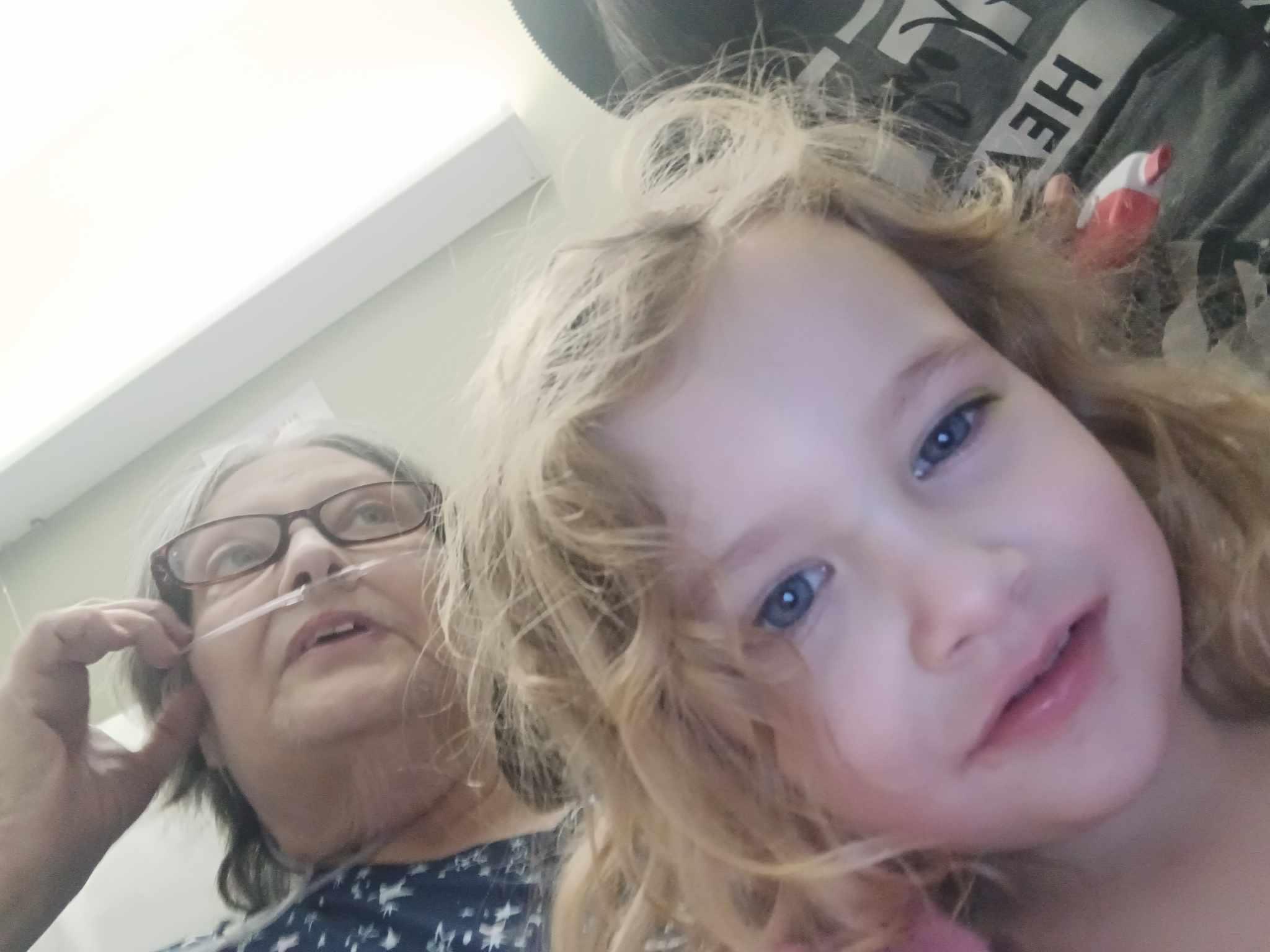 A woman and child taking a selfie