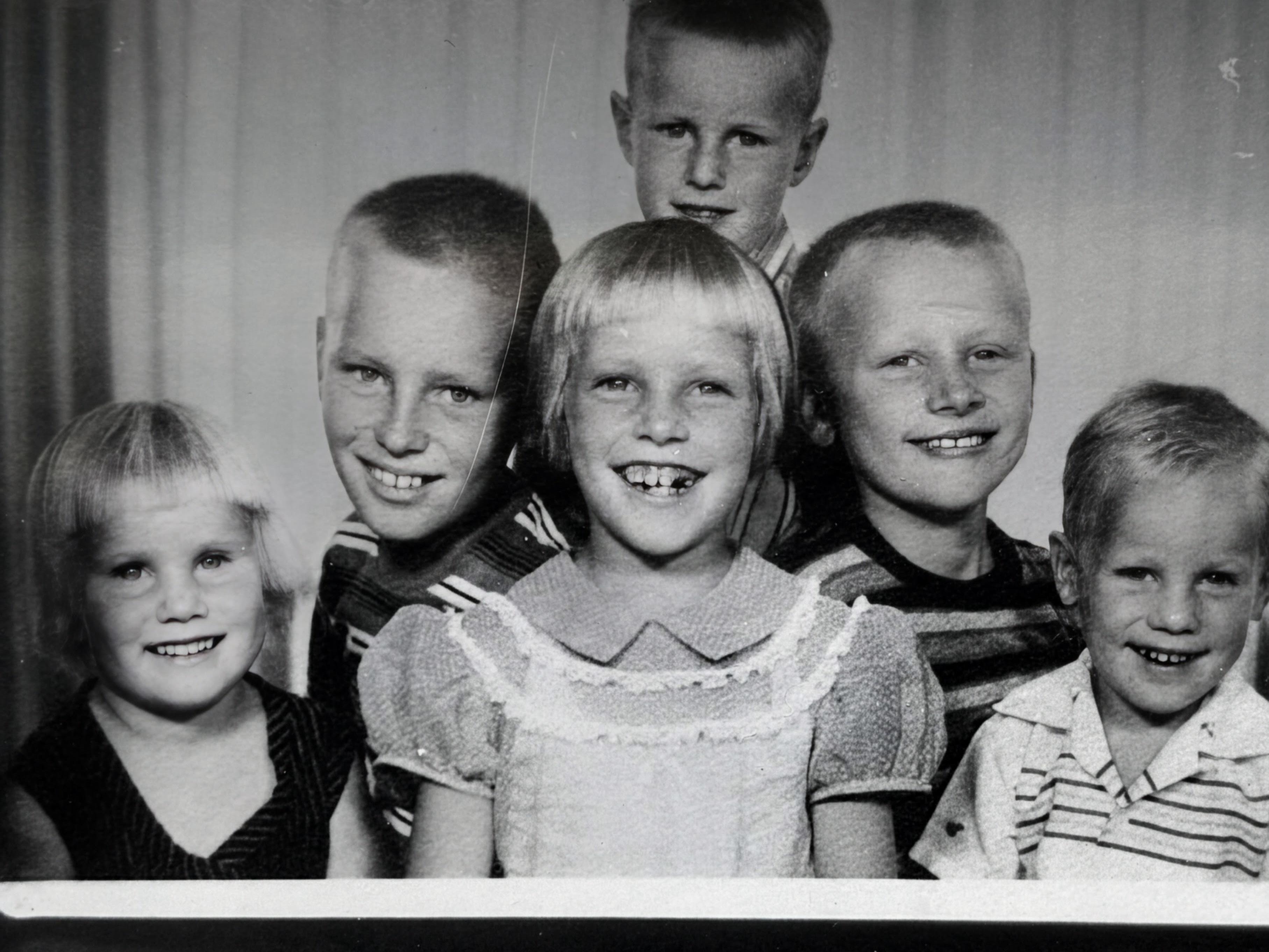 A group of children smiling