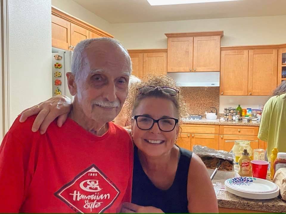 A man and woman posing for a picture