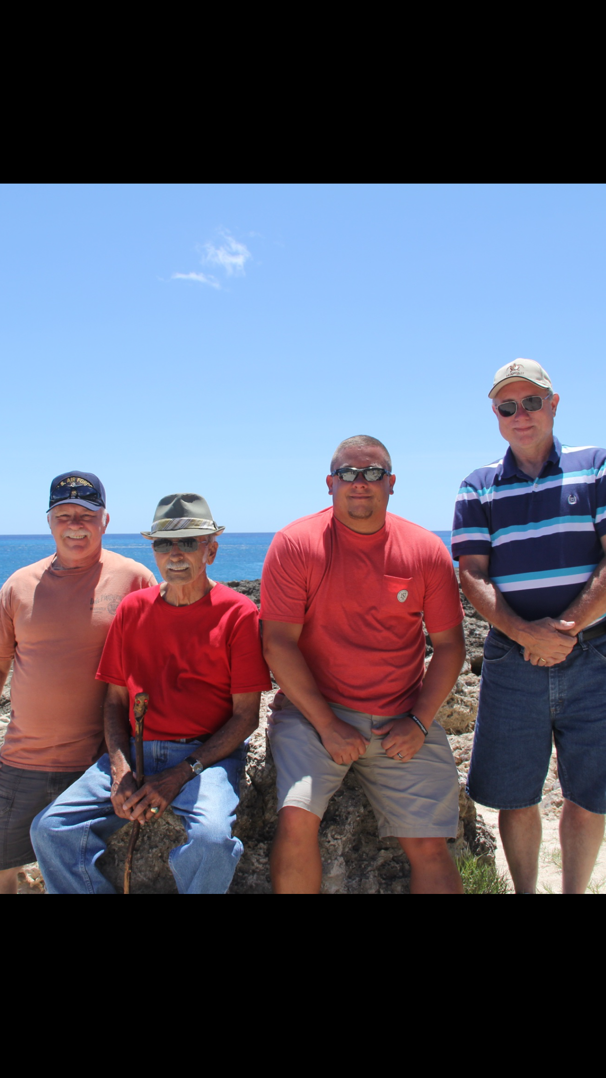 A group of men posing for a picture