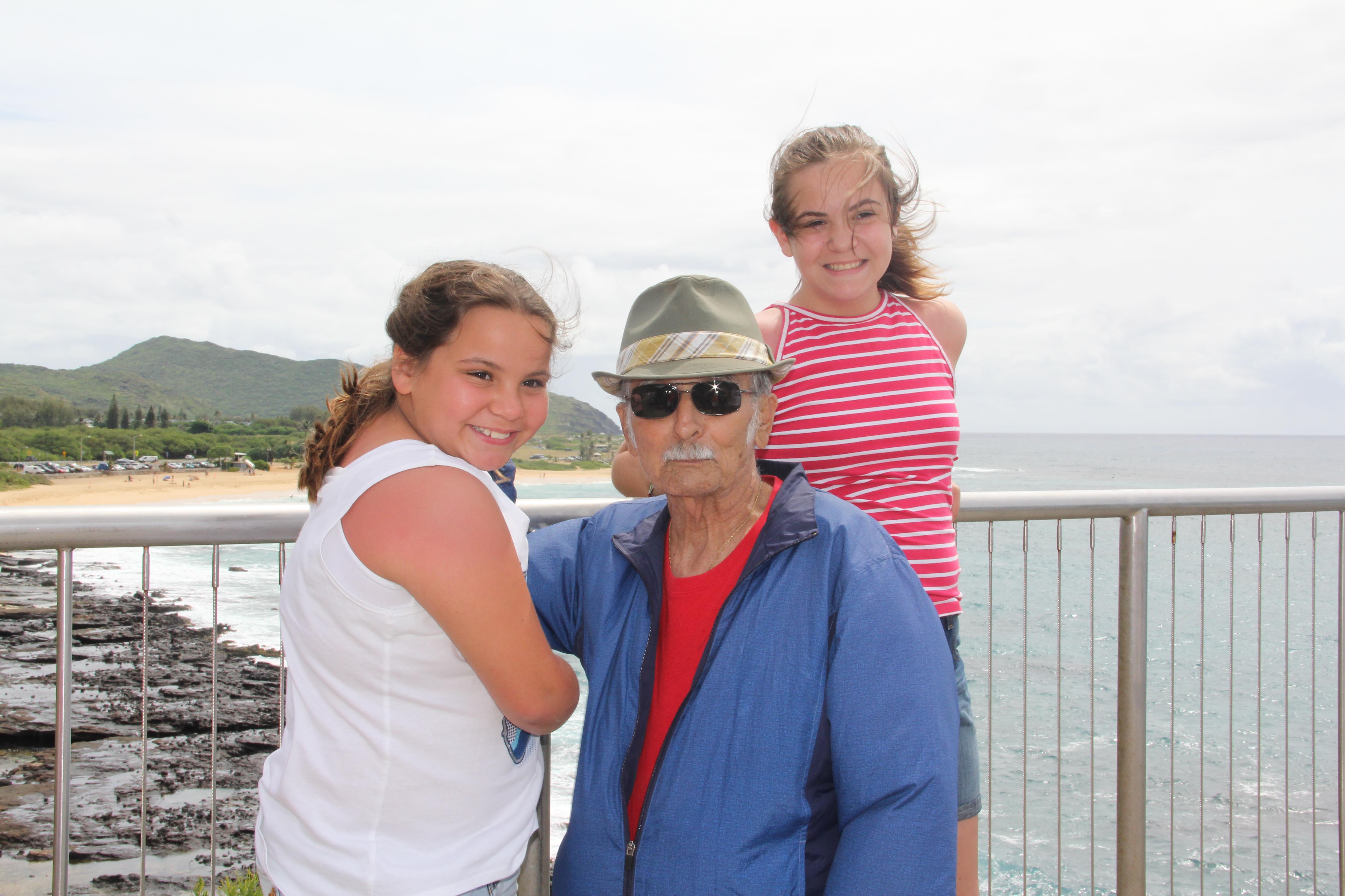 A man and two girls posing for a picture