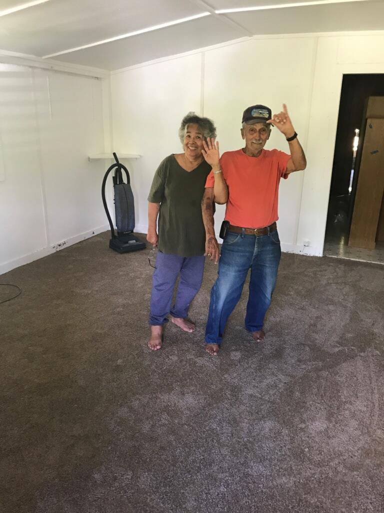 A man and woman posing for a picture
